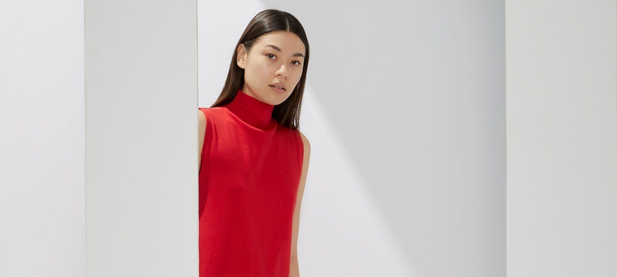 Asian woman wearing red sleeveless skivvy dress by A.BCH.