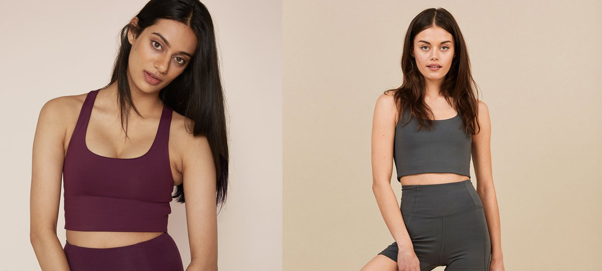 Two women wearing sports leggings and crop tops in burgundy and green