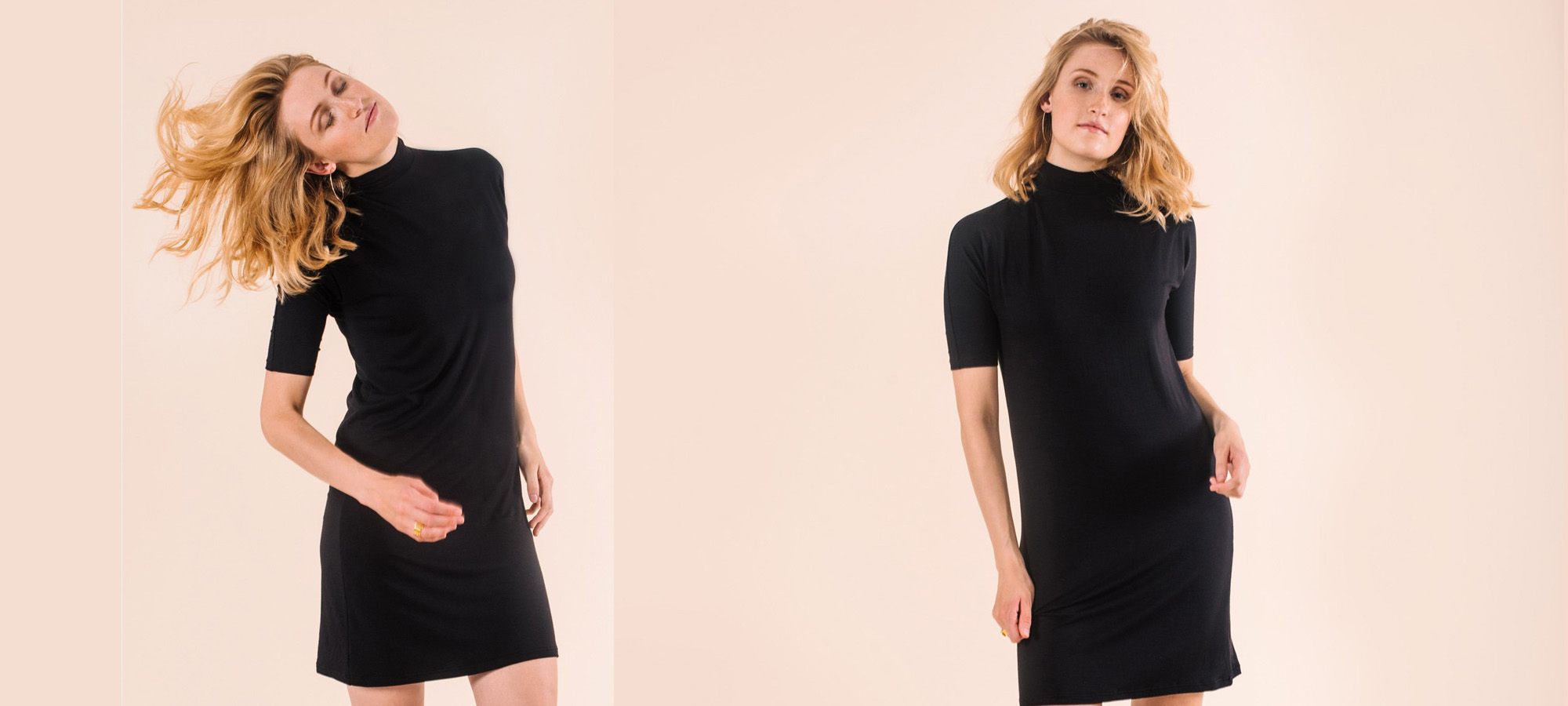 A woman in a black turtle neck dresss swings her hair