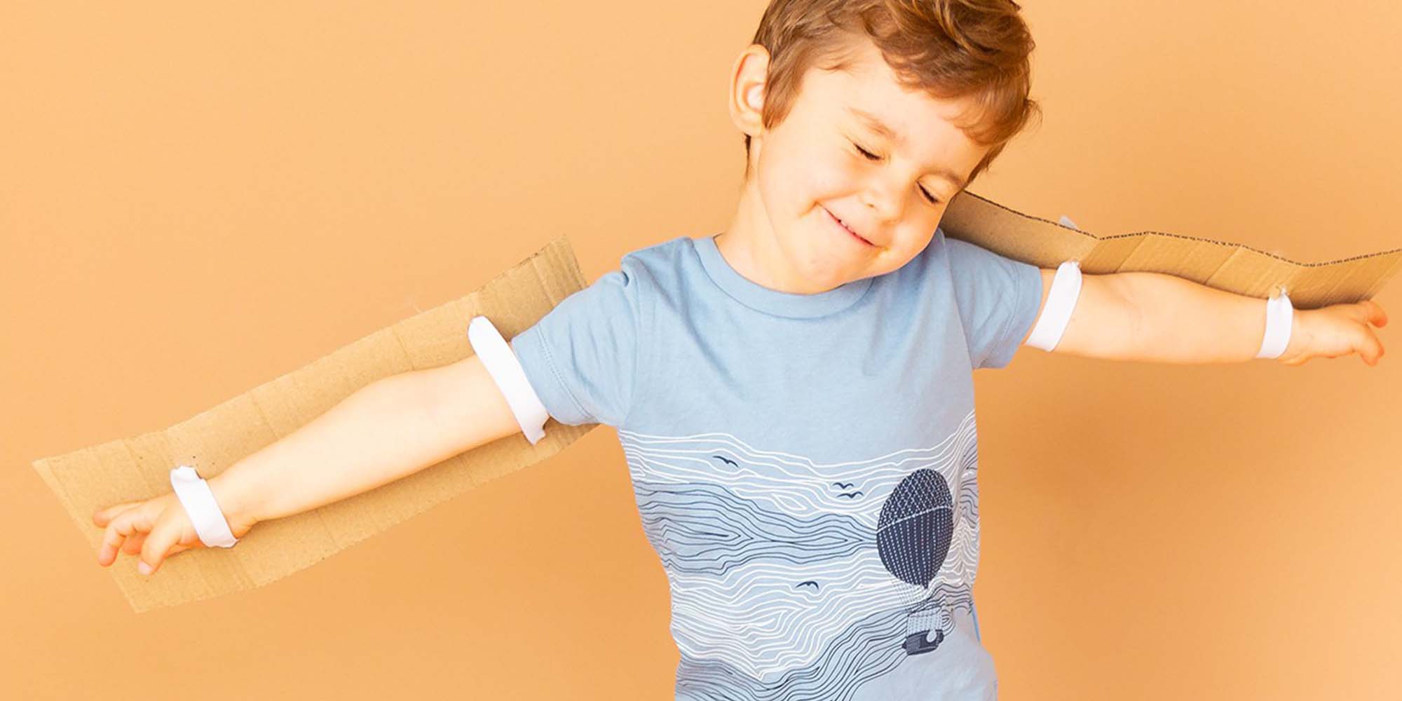 boy wearing blue sense organics t-shirt
