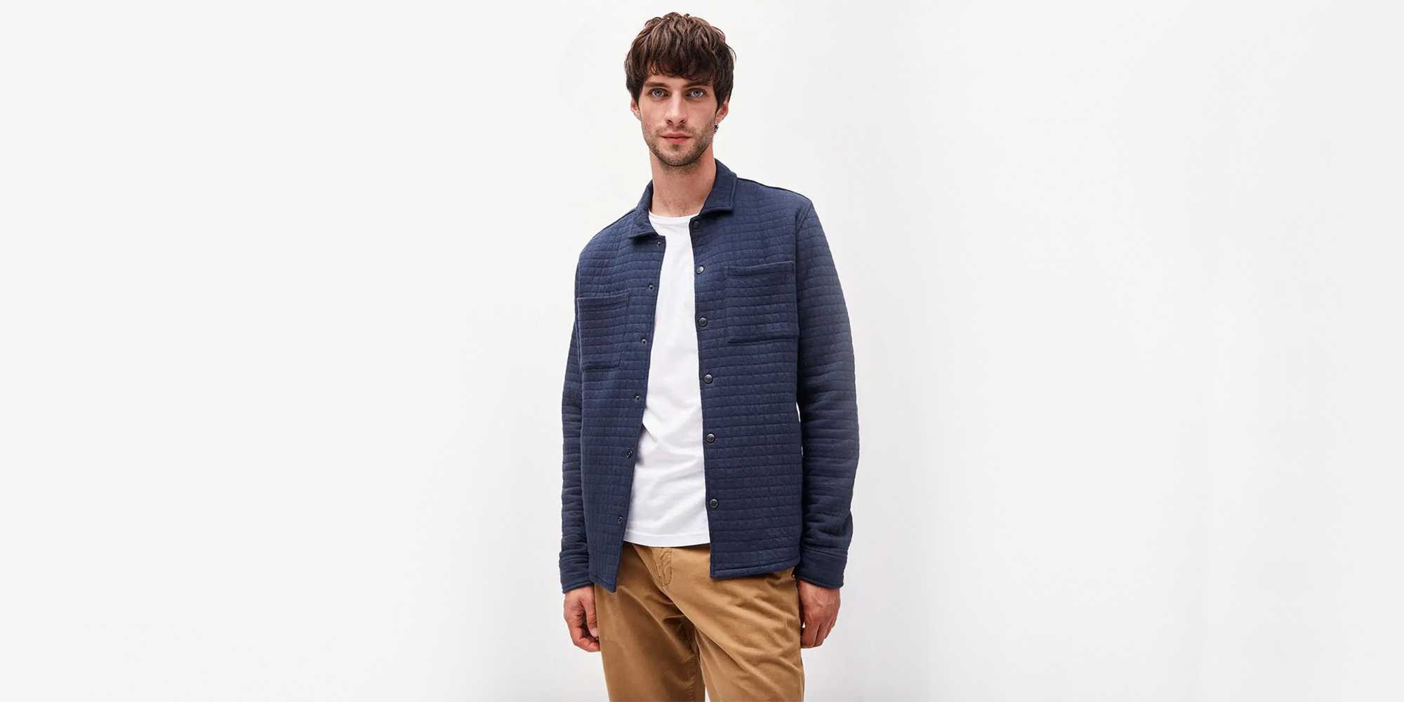 man wearing dark blue sustainable shirt by armedangels