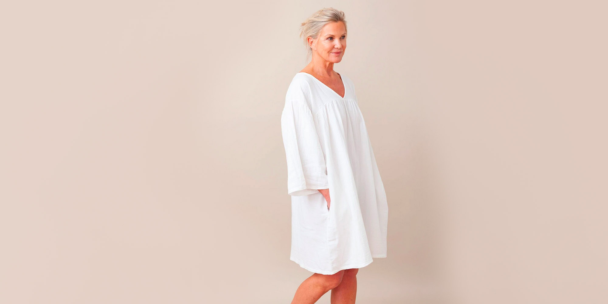 woman wearing white organic cotton nigtie by beaumont organic