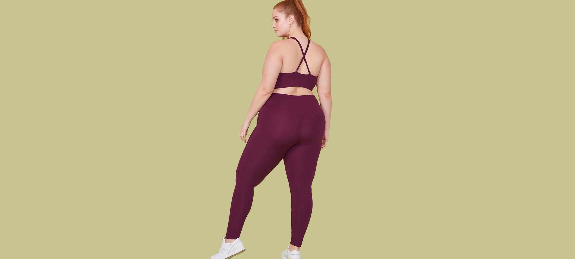 woman wearing burgundy girlfriend collective leggings