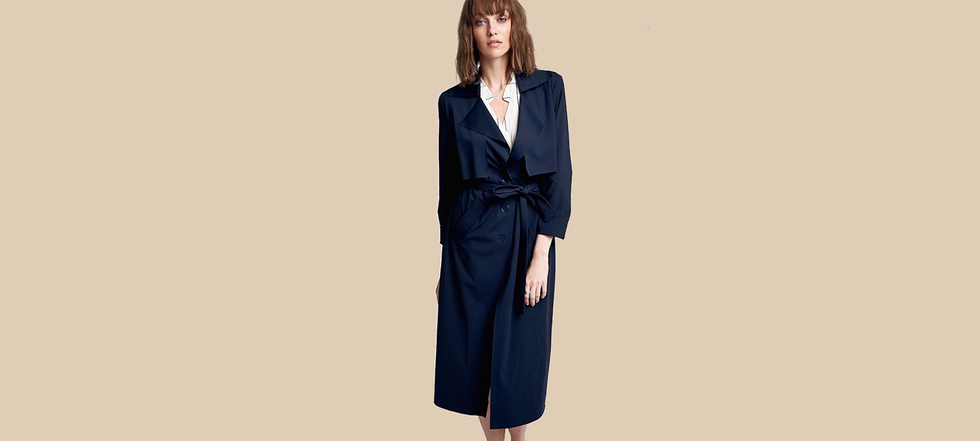 woman wearing dark blue jan n june trench