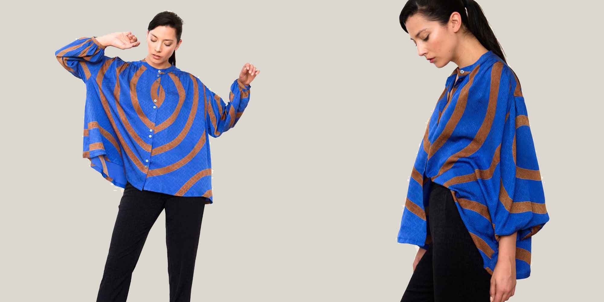 woman wearing blue printed blouse by seek collective