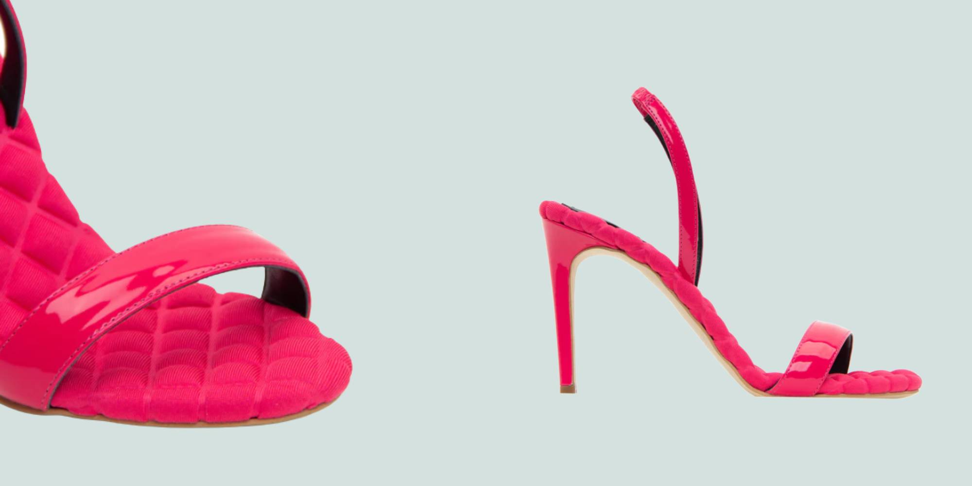A pair of bright pink high heel sandals by shoe brand AERA.