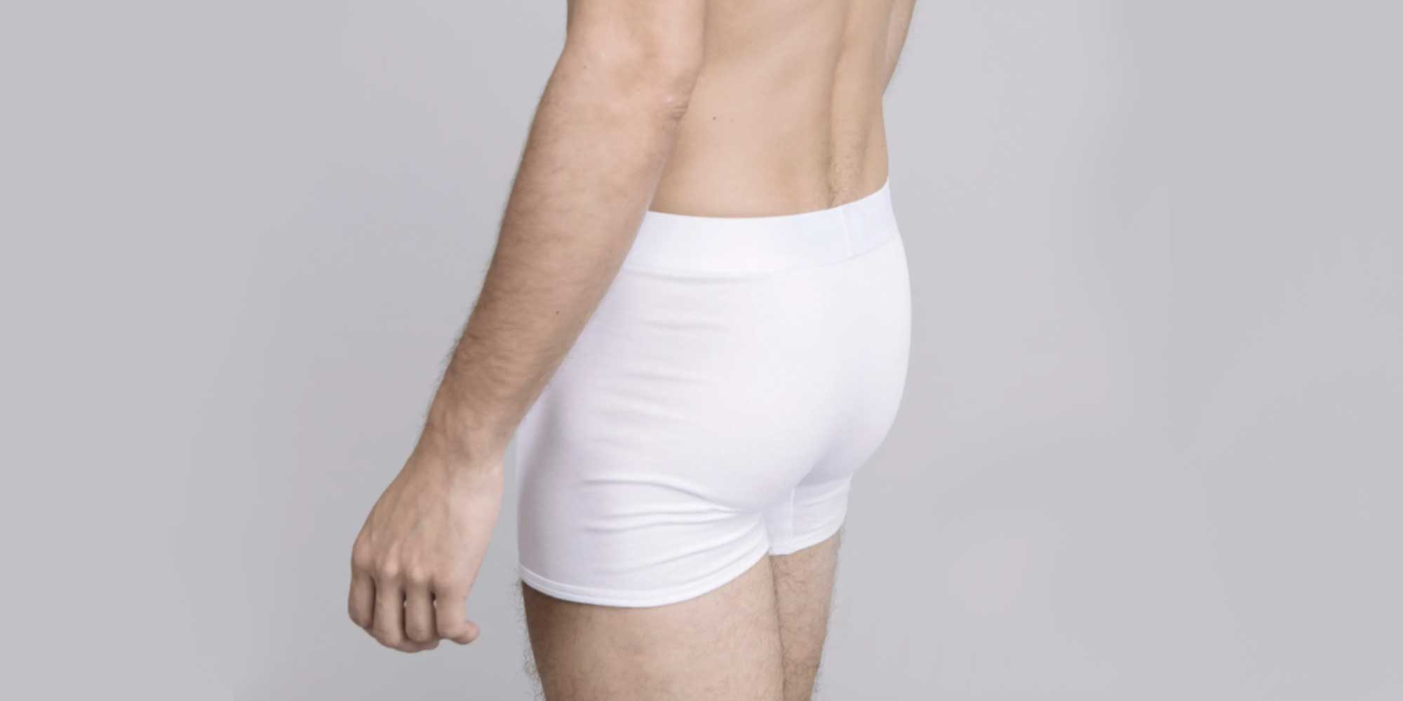 man wearing asket's sustainable boxer briefs in white