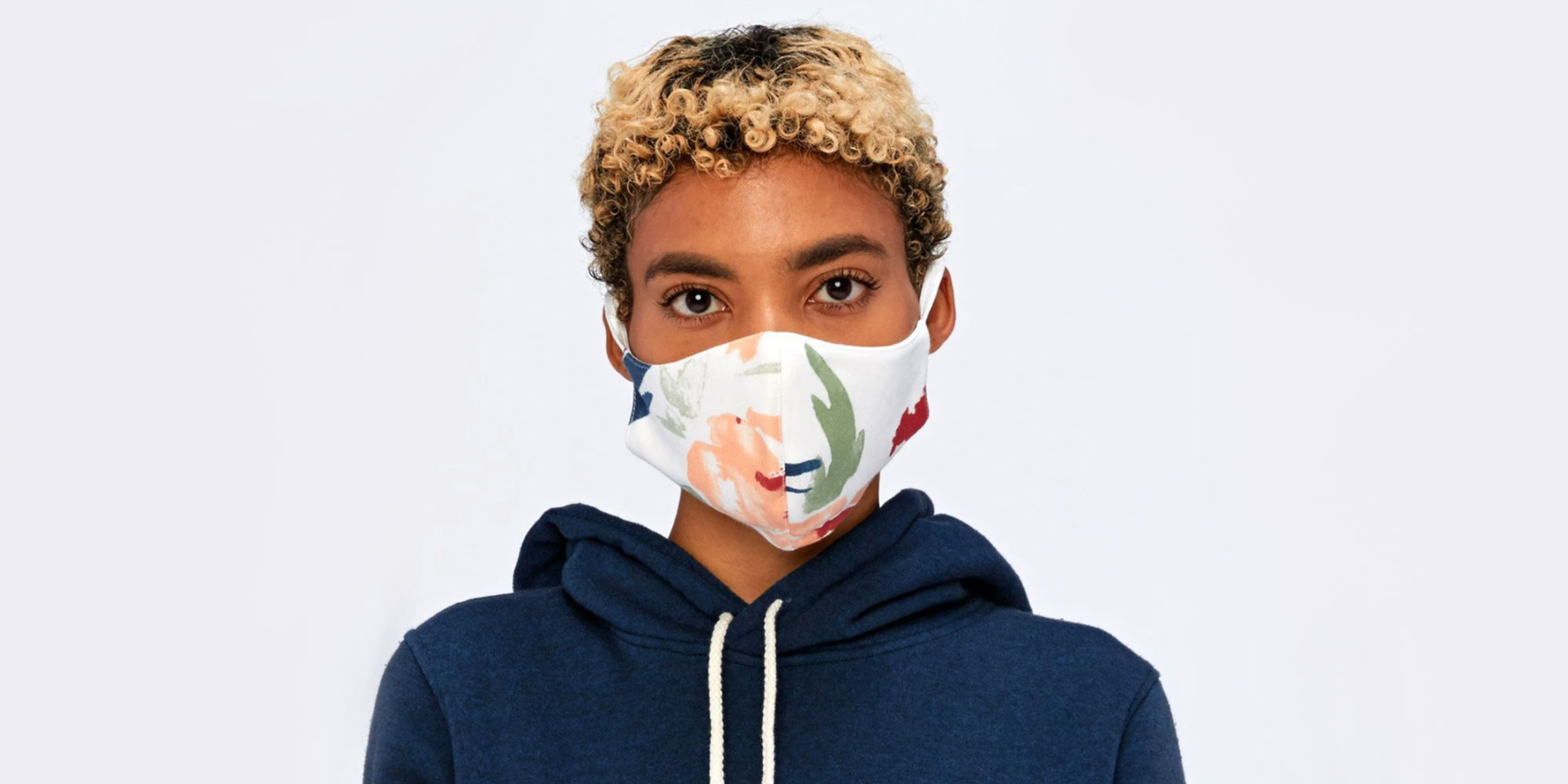 woman of colour wearing colourful sustainable face mask by threads 4 thought brand