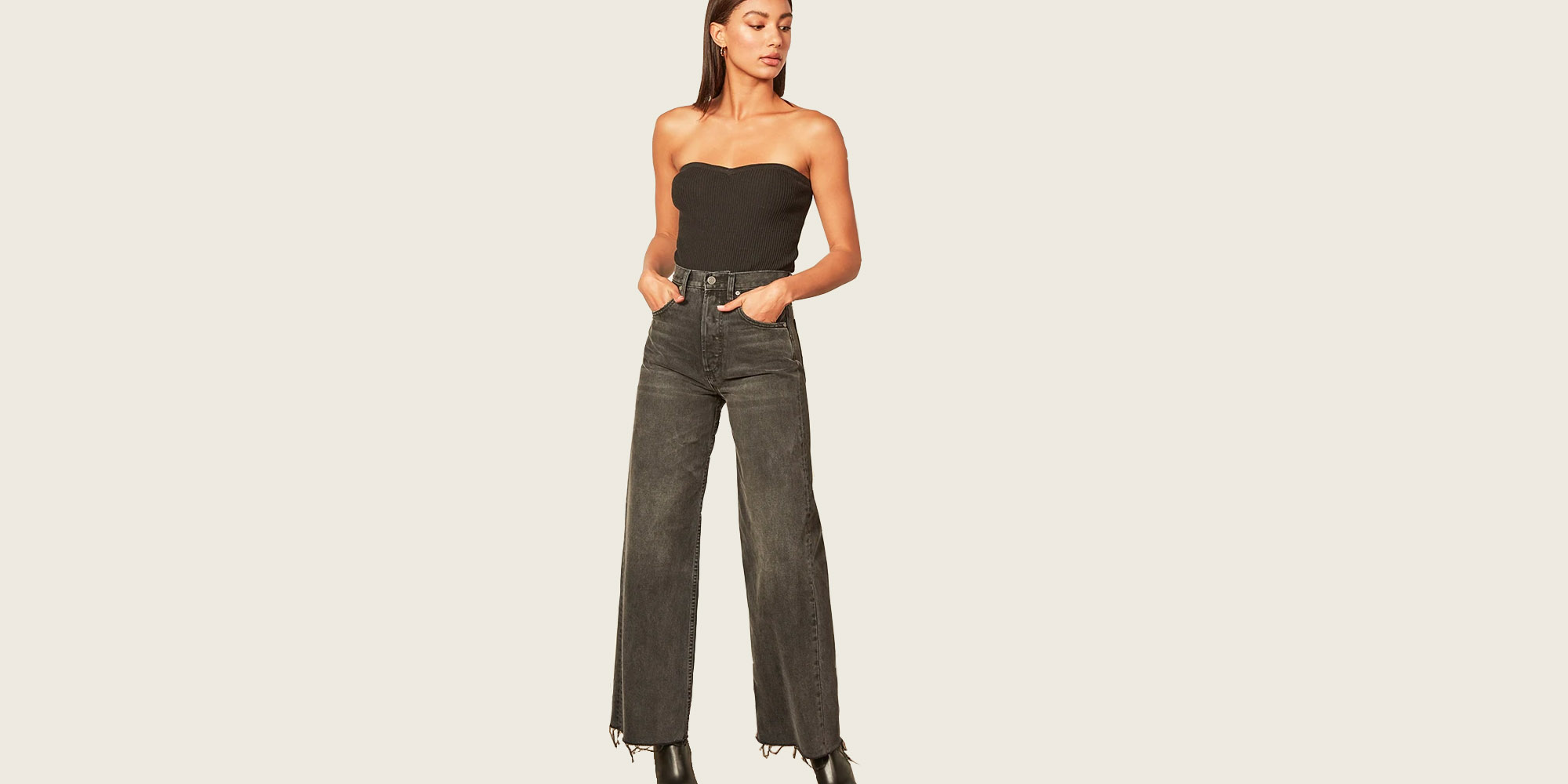 Woman in dark wash ethical fringe trousers