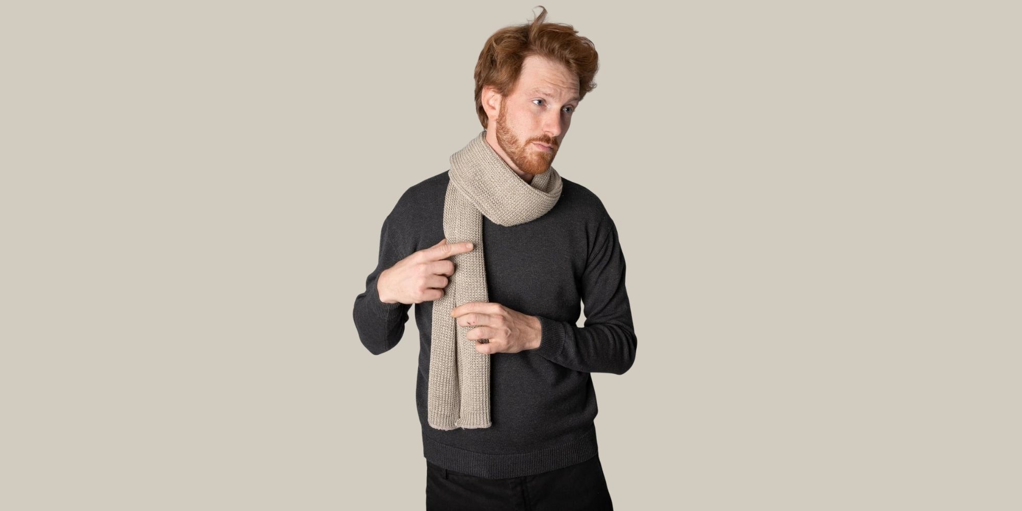 Someone wearing a chunky 100% hemp scarf in beige by Opera Campi.