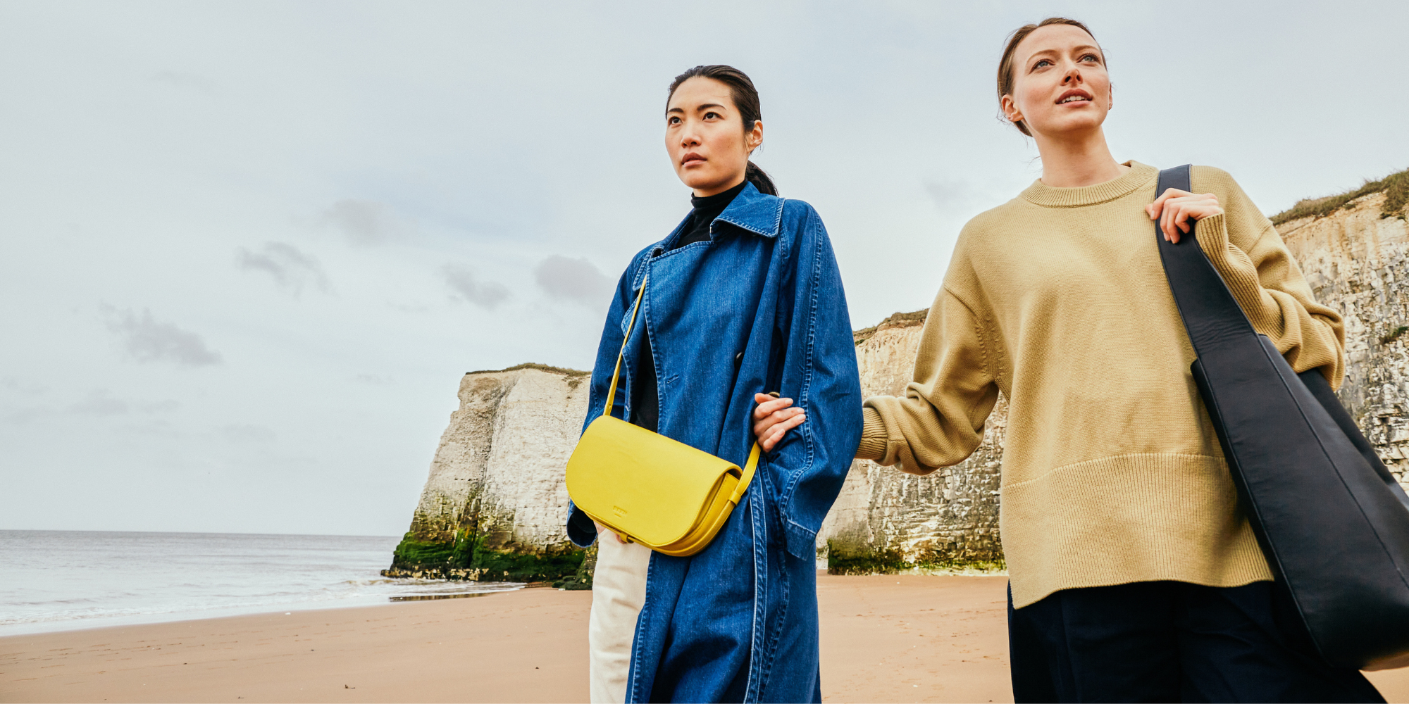 People wearing a yellow shoulder bag and large, dark tote by BEEN London.