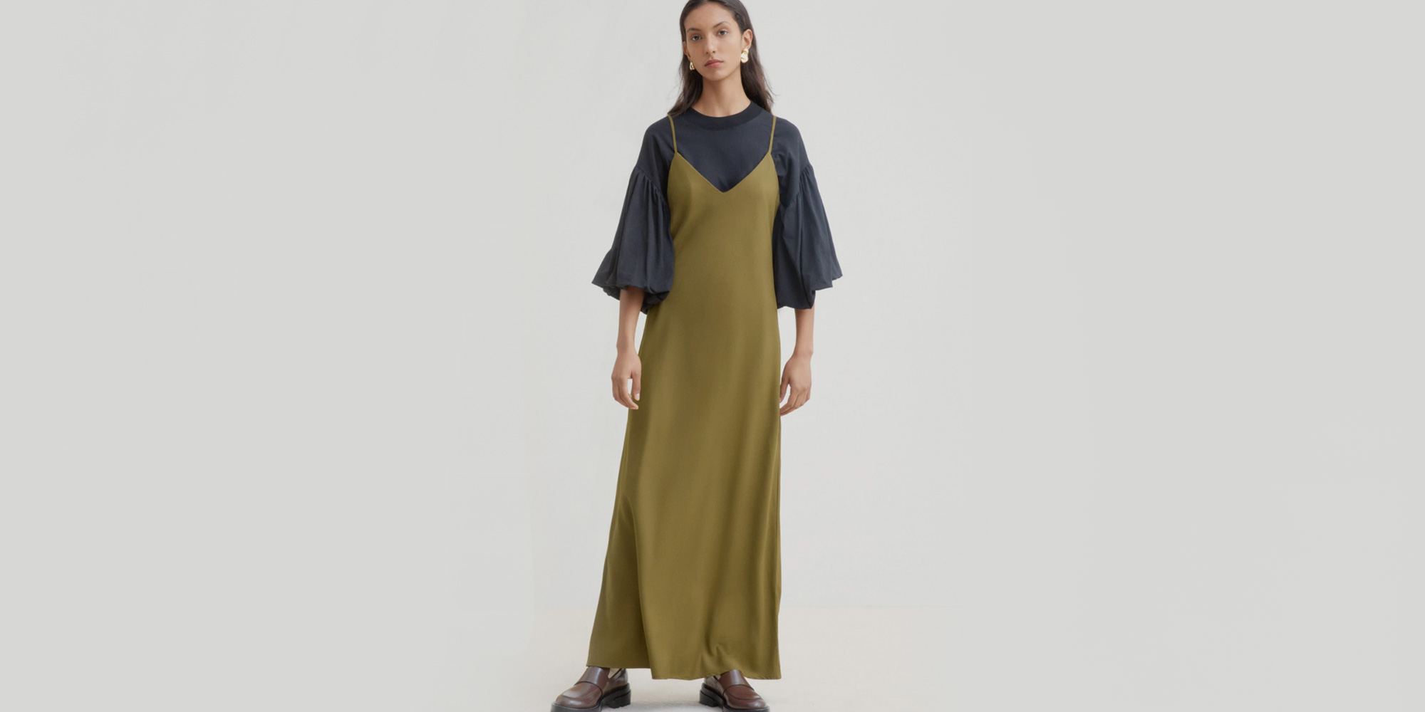 woman wearing dark green kowtow slip dress