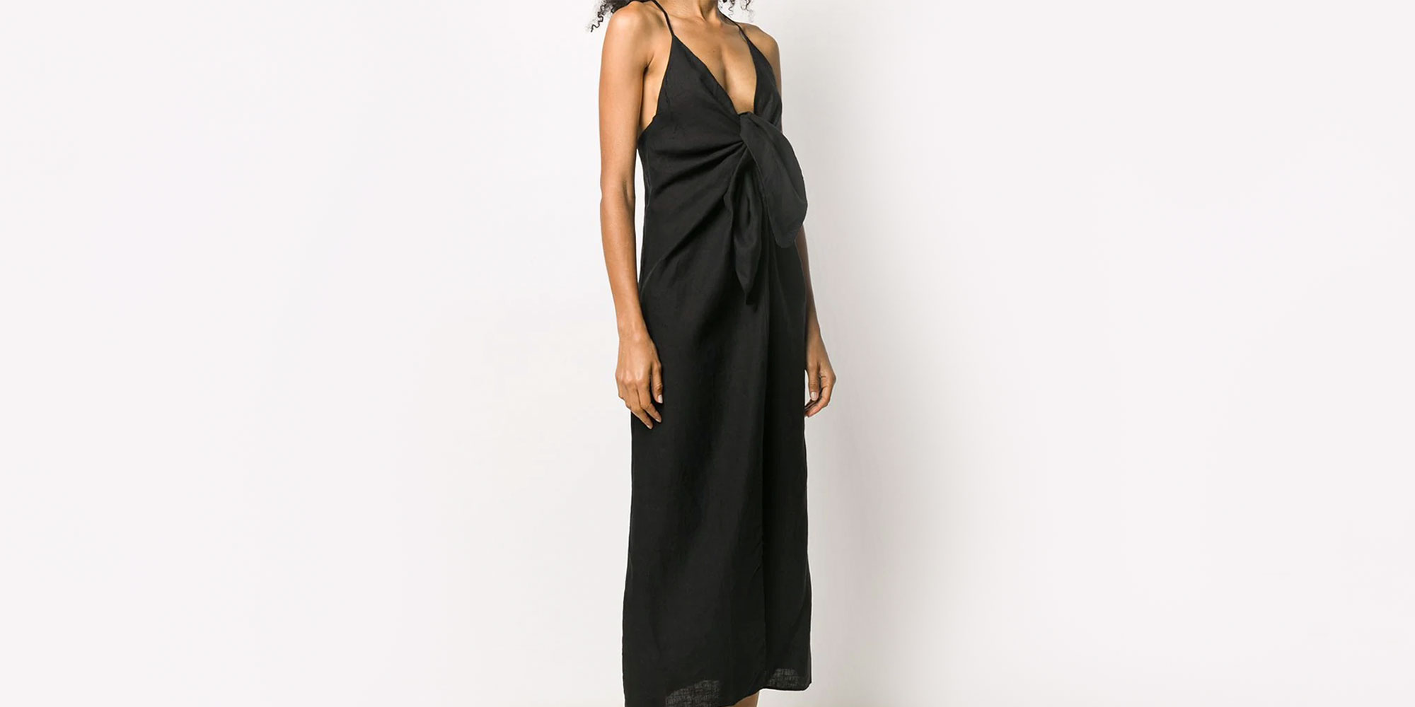 woman wearing black linen knotted slip dress from Mara Hoffman
