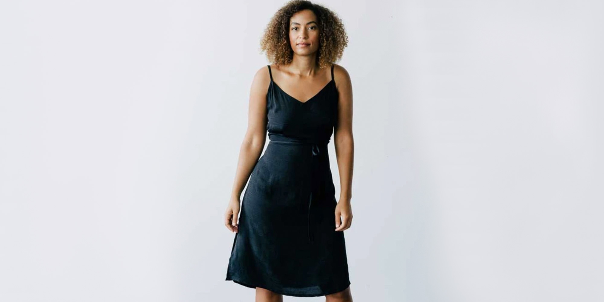 woman wearing black seek collective slip dress