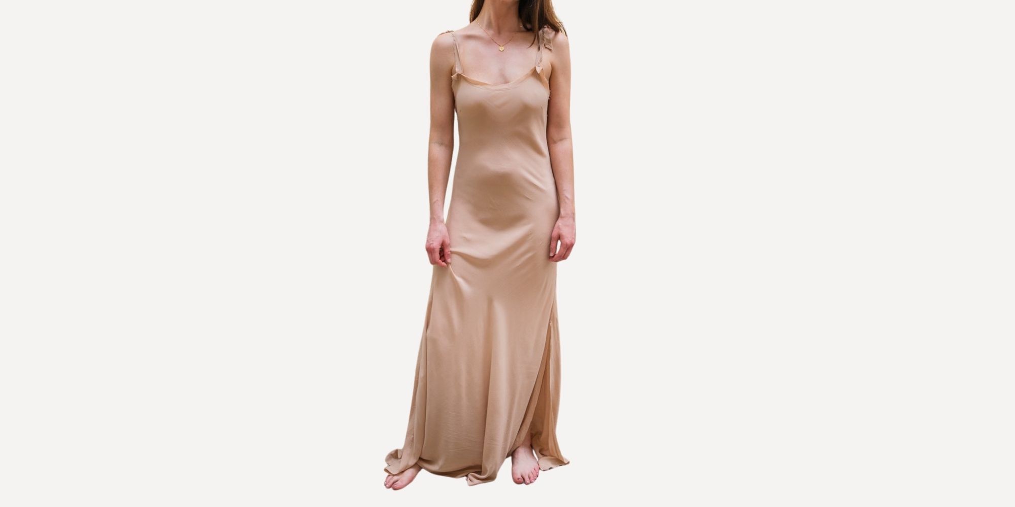 woman wearing light rose long slip dress sustainably made by Nightswim via Curate