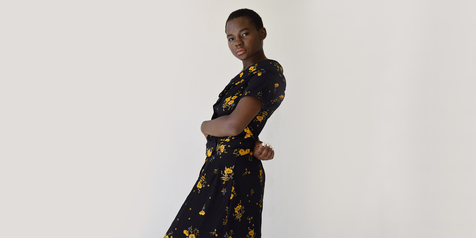 woman wearing floral blouse by label by three