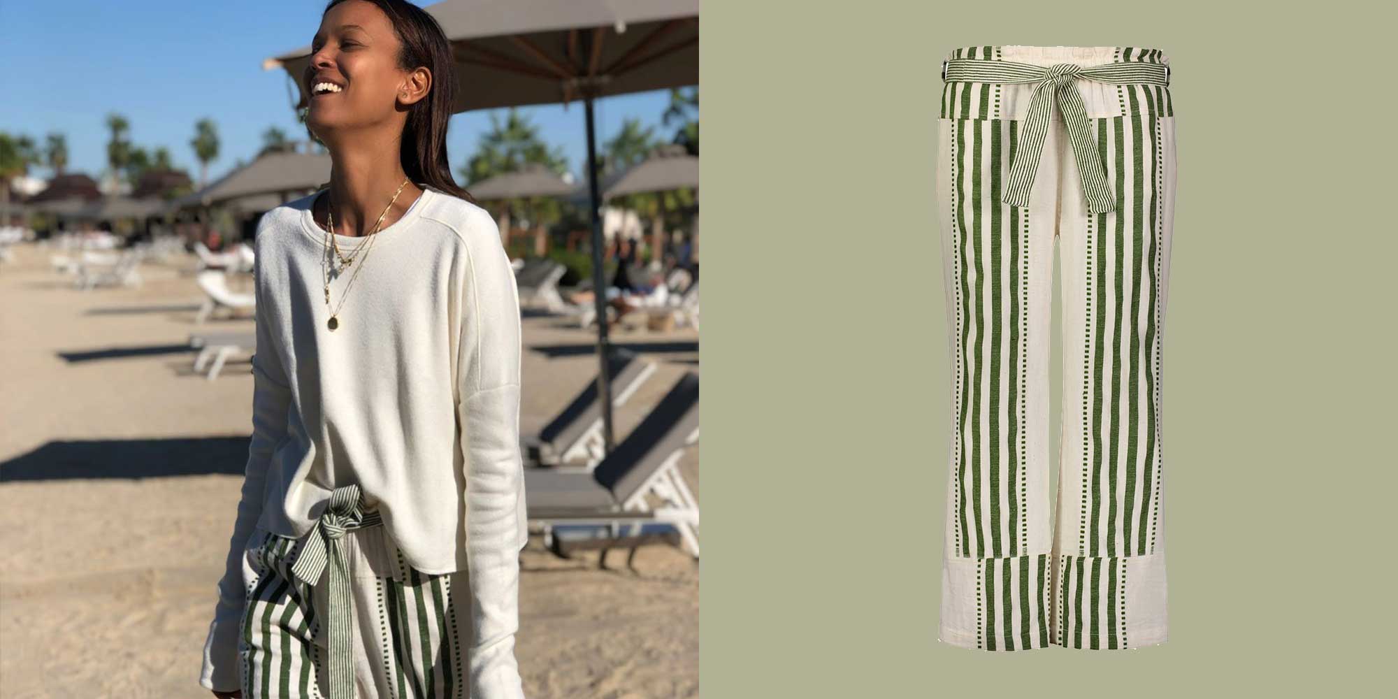 woman wearing striped green pants by lemlem