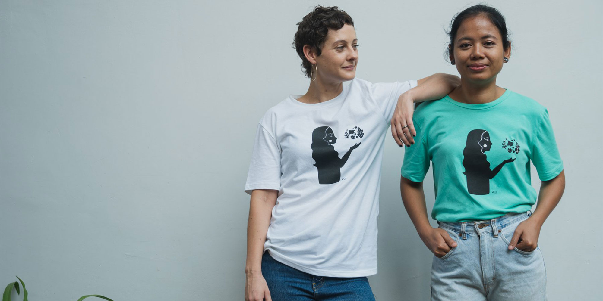 women wearing green and white ethical t-shirts by dorsu