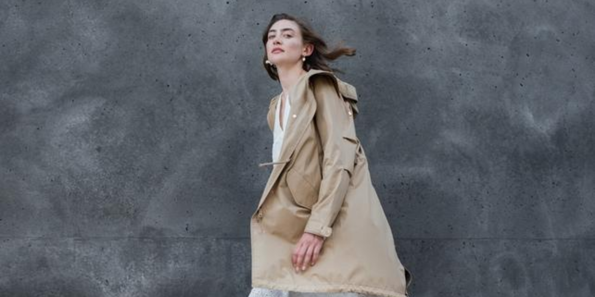 woman wearing sustainable beige outdoor coat by ethical German brand LangerChen
