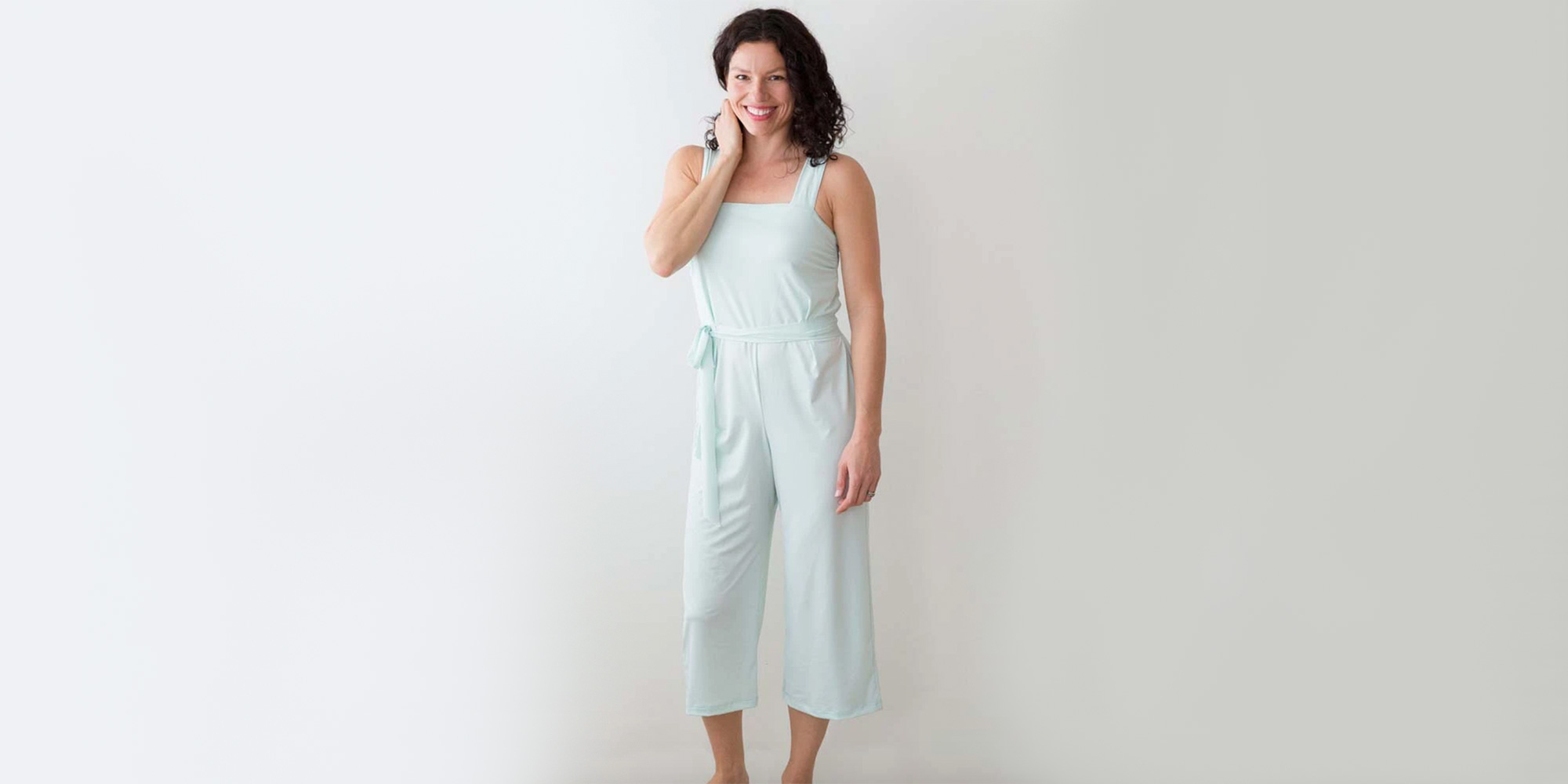 woman wearing light blue ethical jumpsuit by eclipse