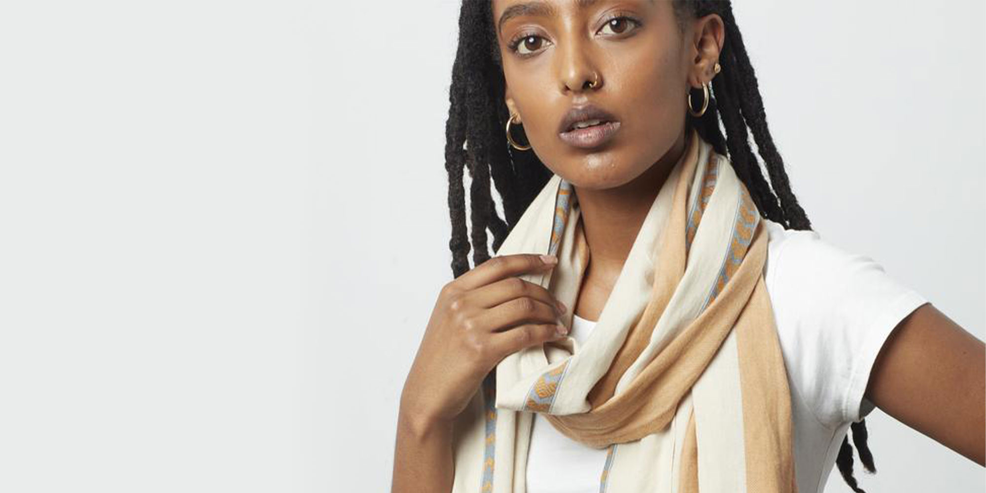 woman wearing clothes and accessories by know supply