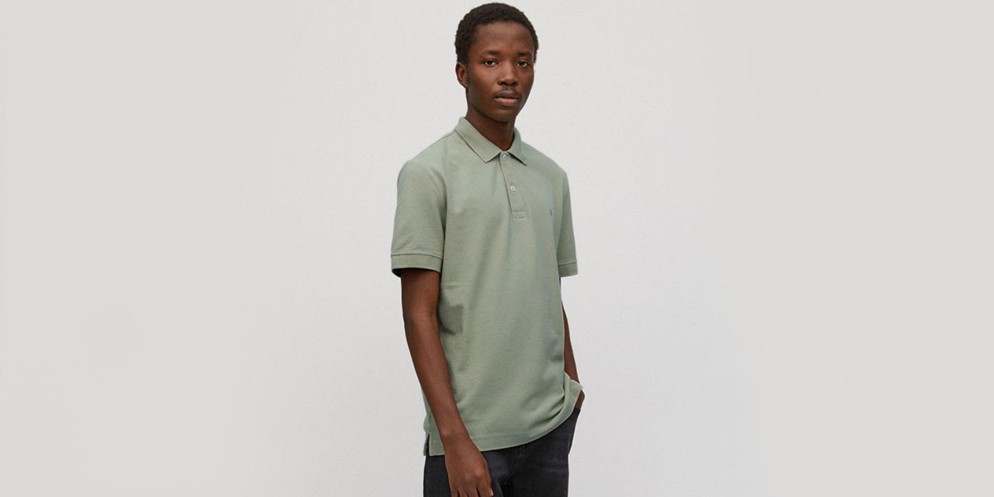 man wearing dustry green polo shirt by armedangels