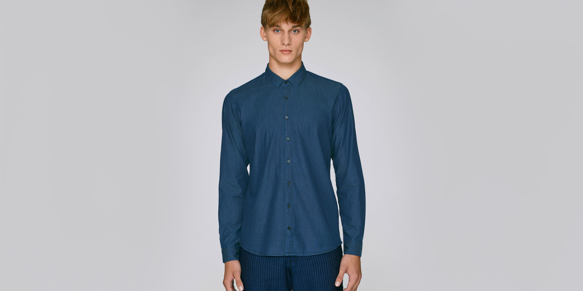 man wearing dark blue denim shirt by stanley stella