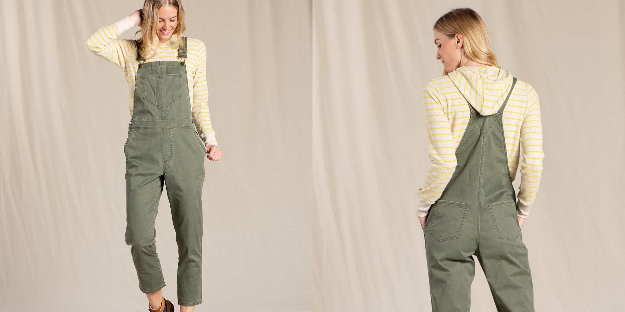 Someone wearing green vintage wash overalls by Toad&Co with a striped white and yellow hoodie underneath.