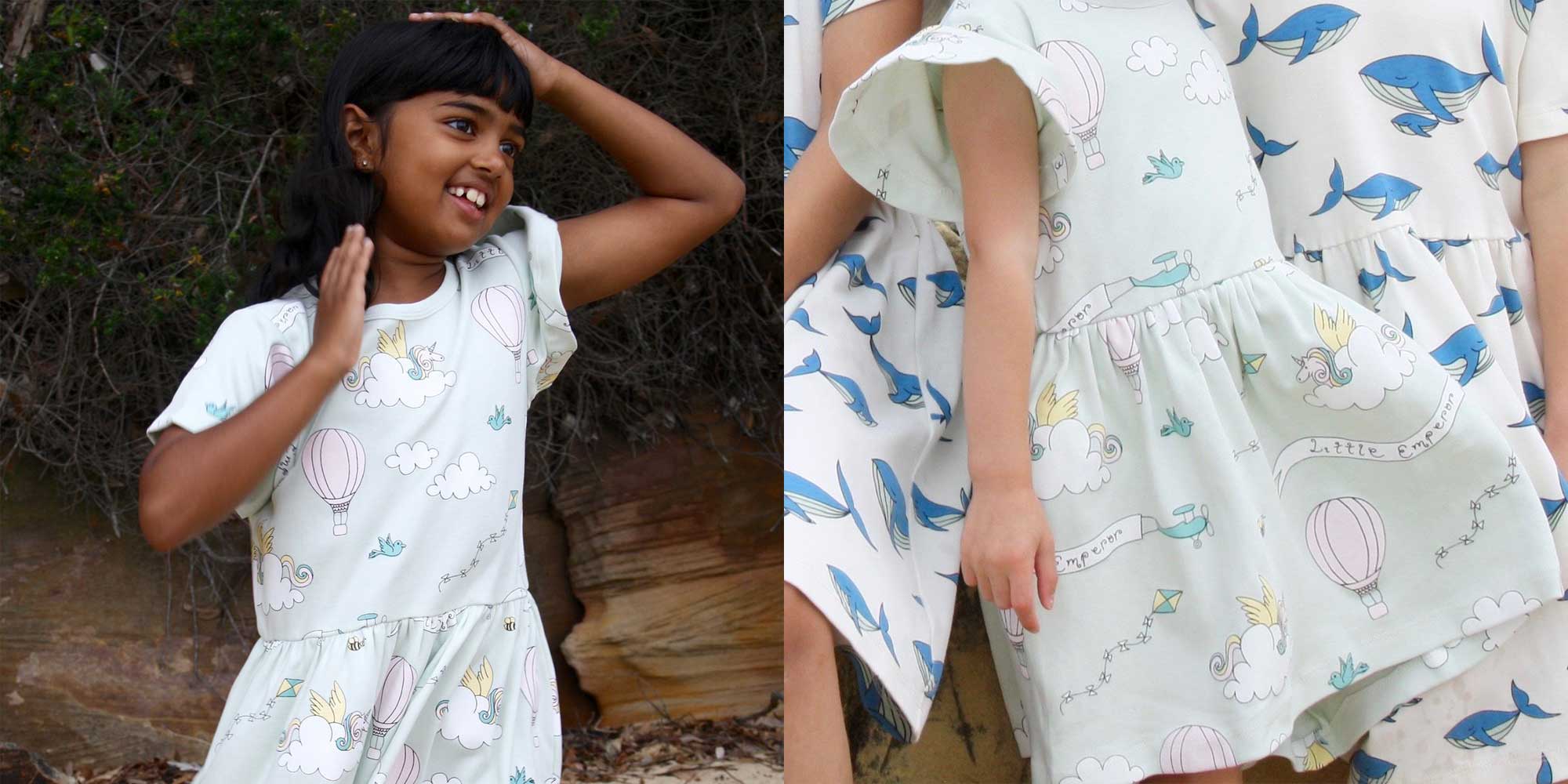 A child wearing an organic dress with unicorn and cloud patterns by Little Emperor.
