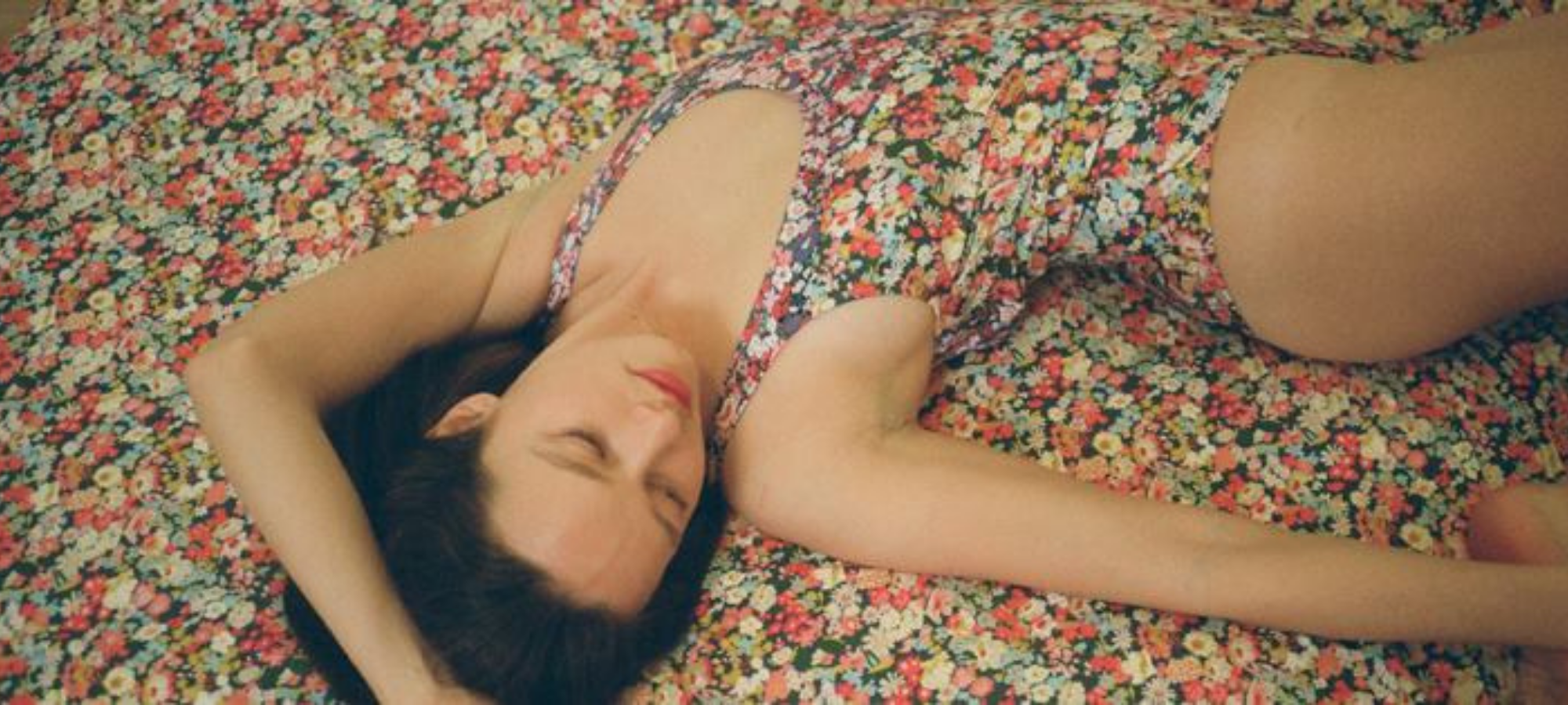 woman wearing sustainable floral lingerie from ethical brand Araks