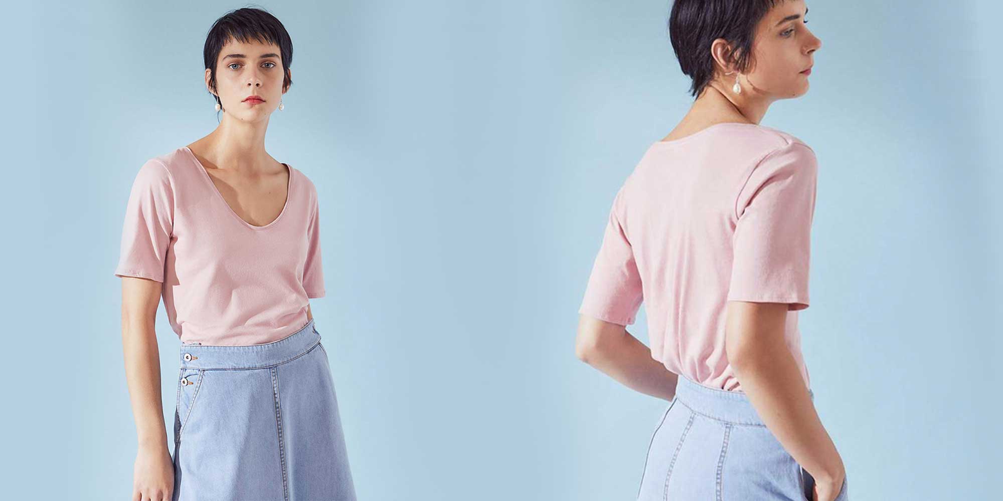 woman wearing light pink v neck t-shirt by kowtow