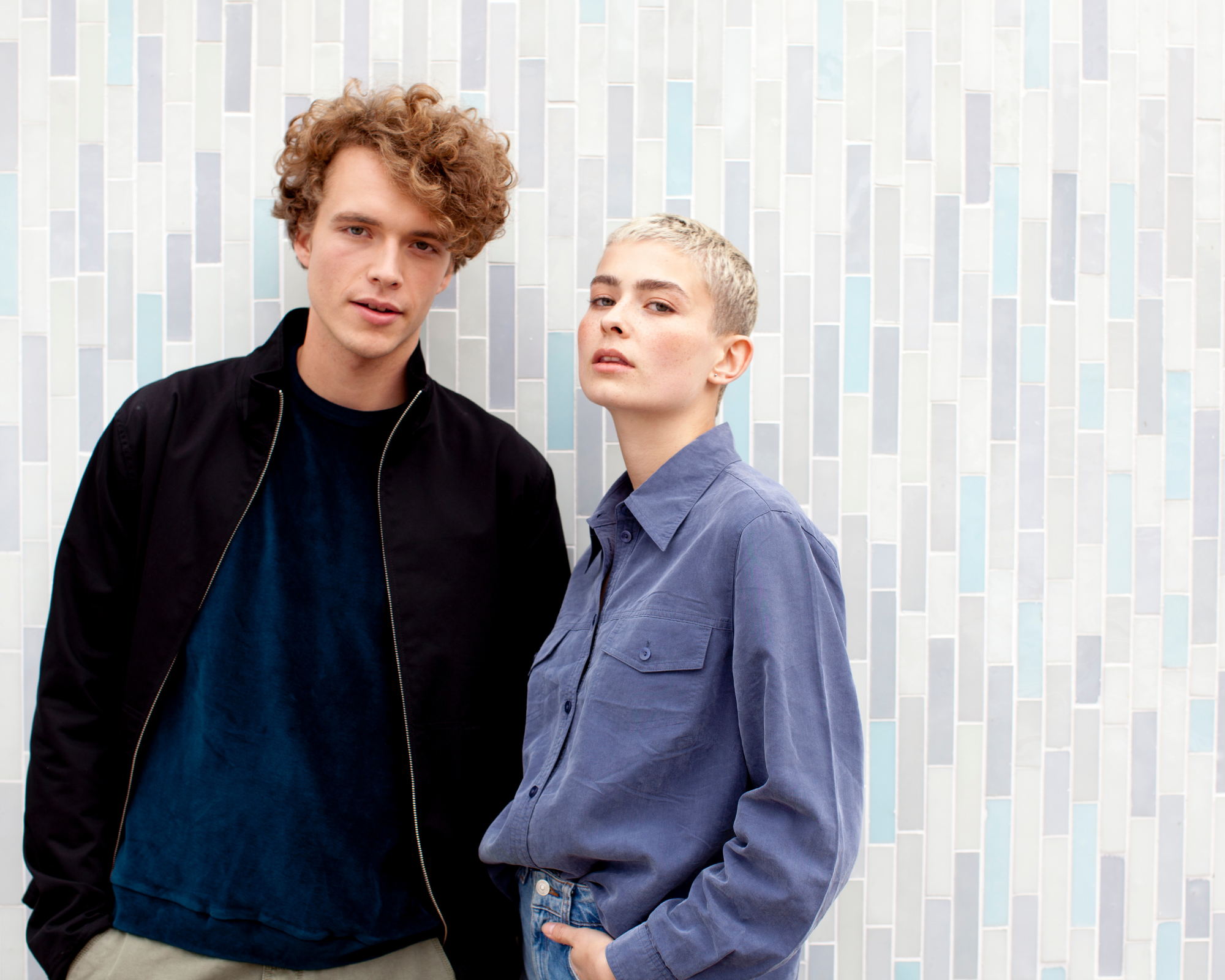 man and woman wearing sustainable coats by Staiy