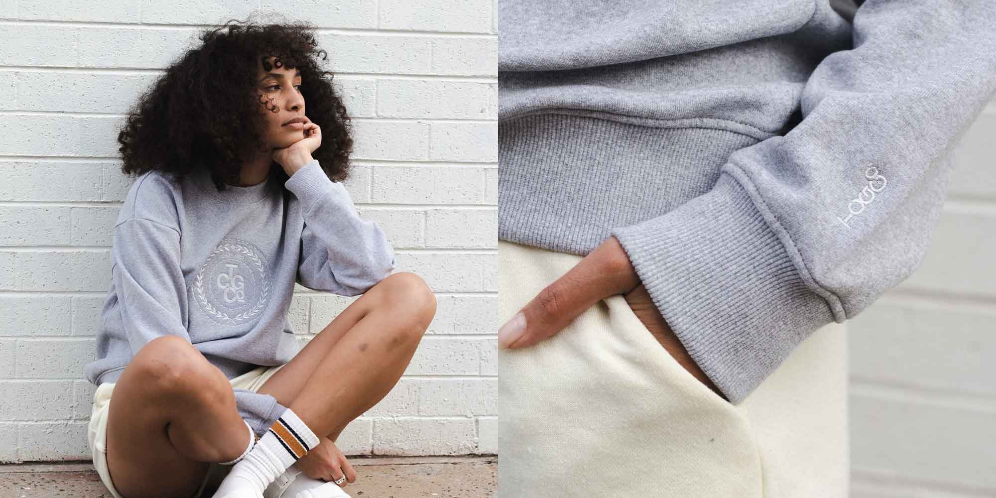 close up of woman wearing grey sweatshirt by the common good company