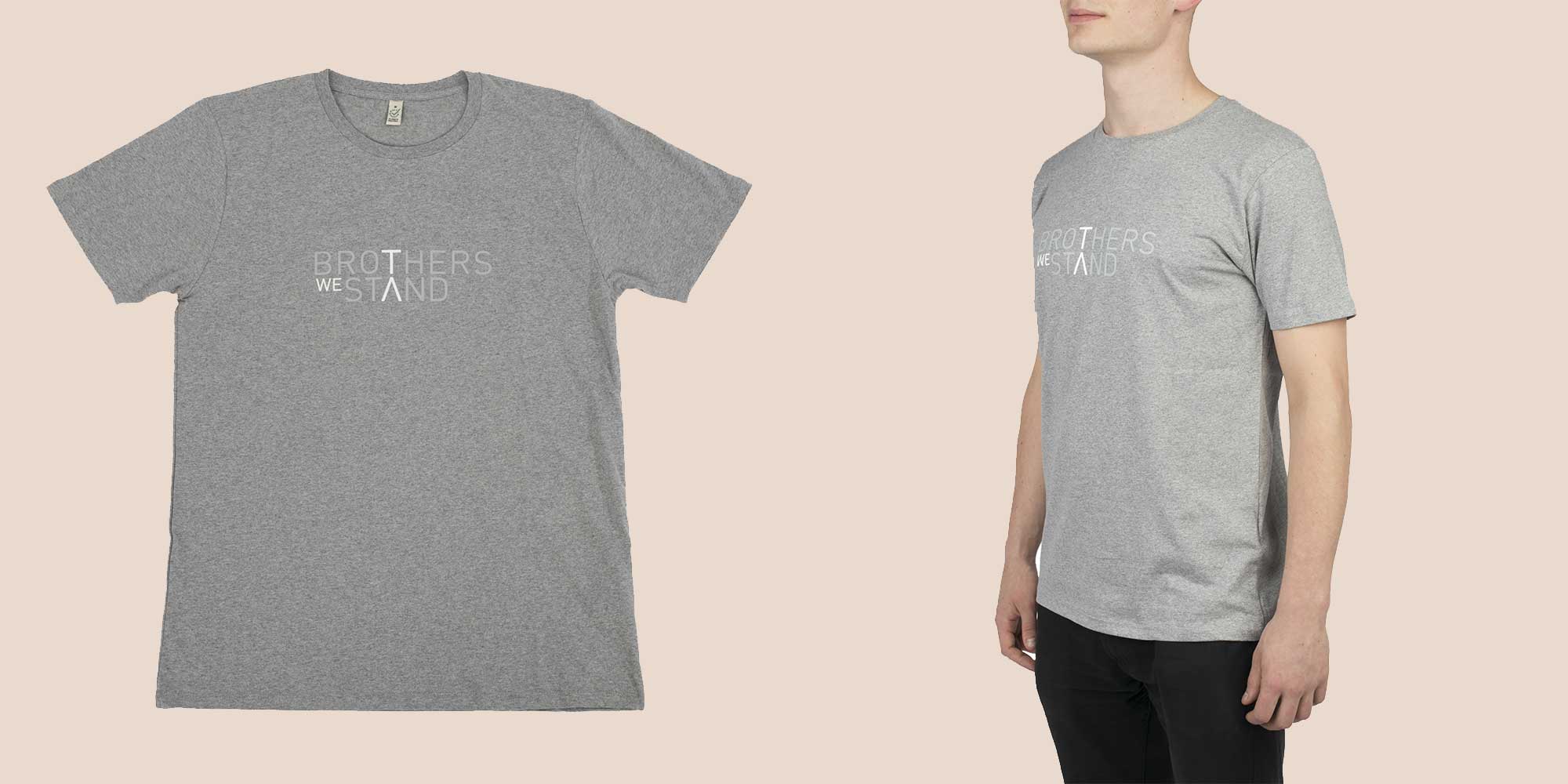 white man wearing grey organic t-shirt with Brothers We Stand logo on the front