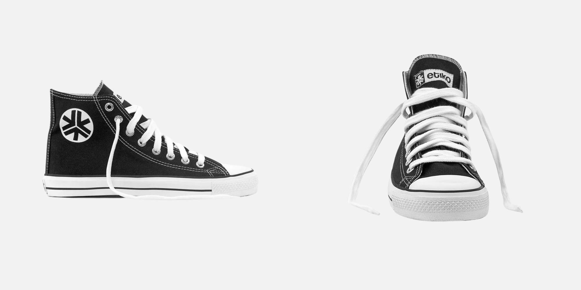 A pair of black high top sneakers with white laces and sole by Etiko.