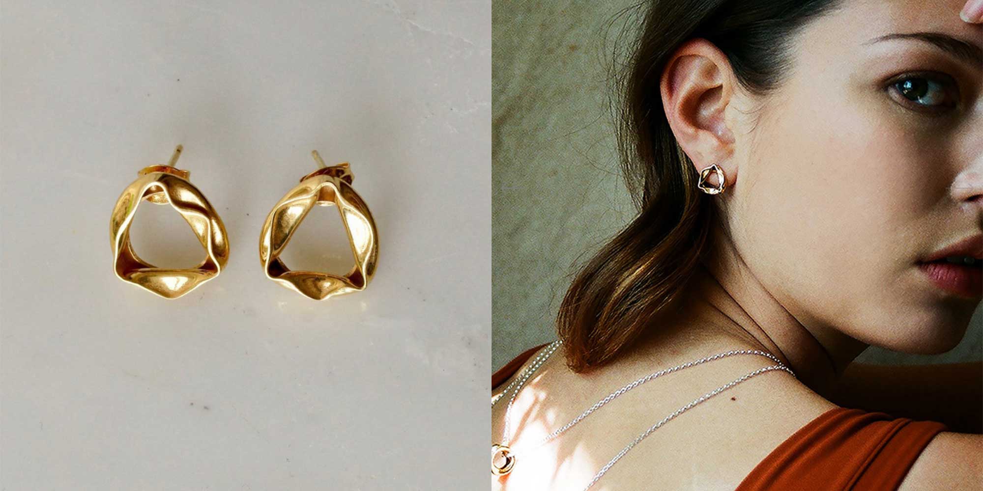 woman wearing small gold hoop earrings by emma aitchison