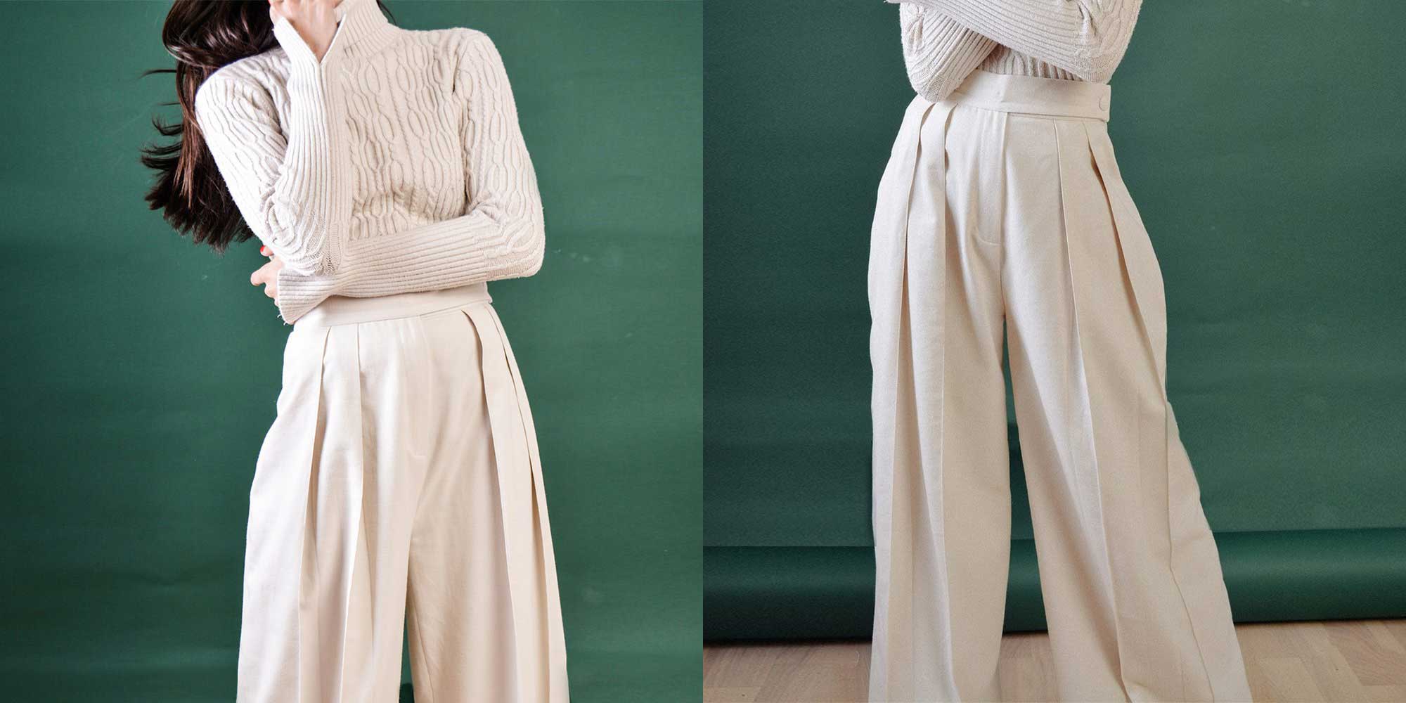 woman wearing cream wide leg pants by bastet noir
