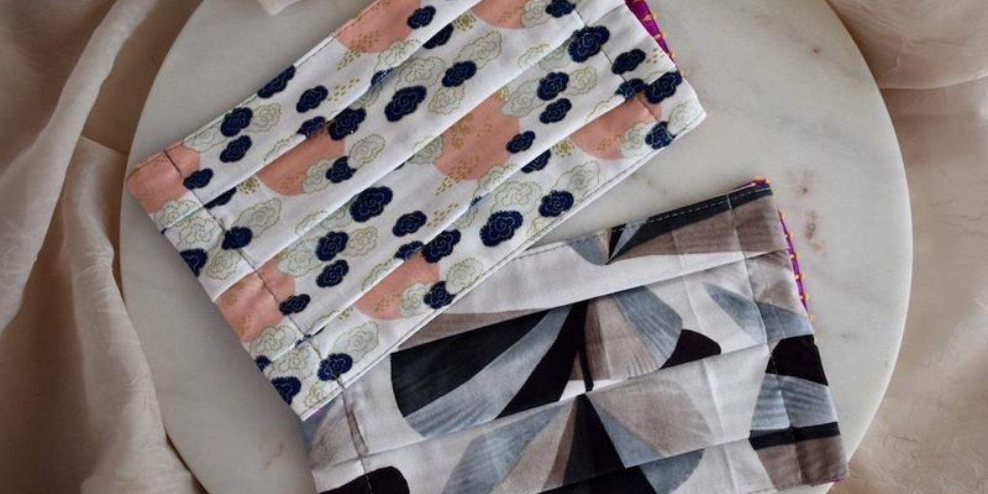 two patterned cotton facemasks by Altar PDX