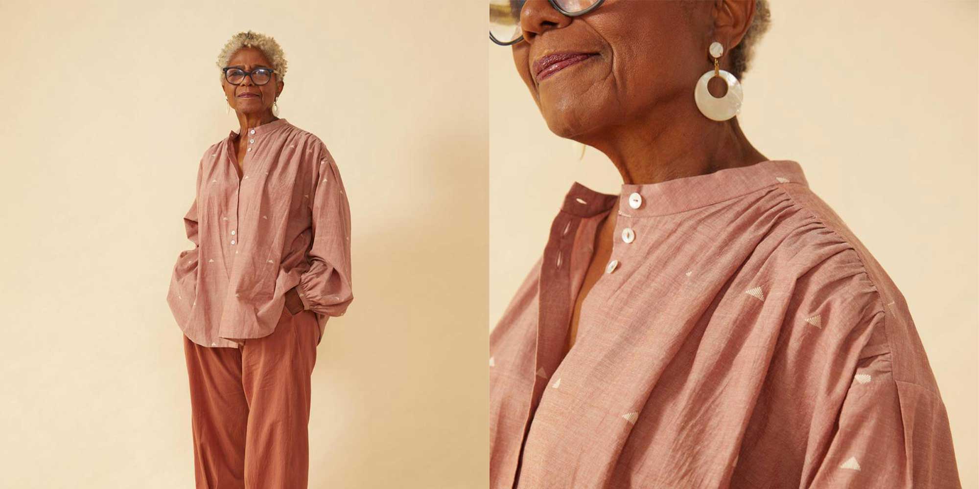 older woman of colour wearing pink Sustainable puff sleeves artist's frock by Seek Collective