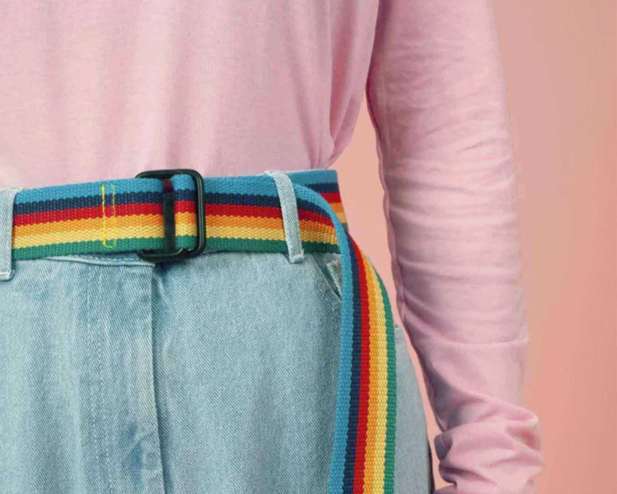 woman wearing rainbow cotton sustainable belt designed by Lucy & Yak