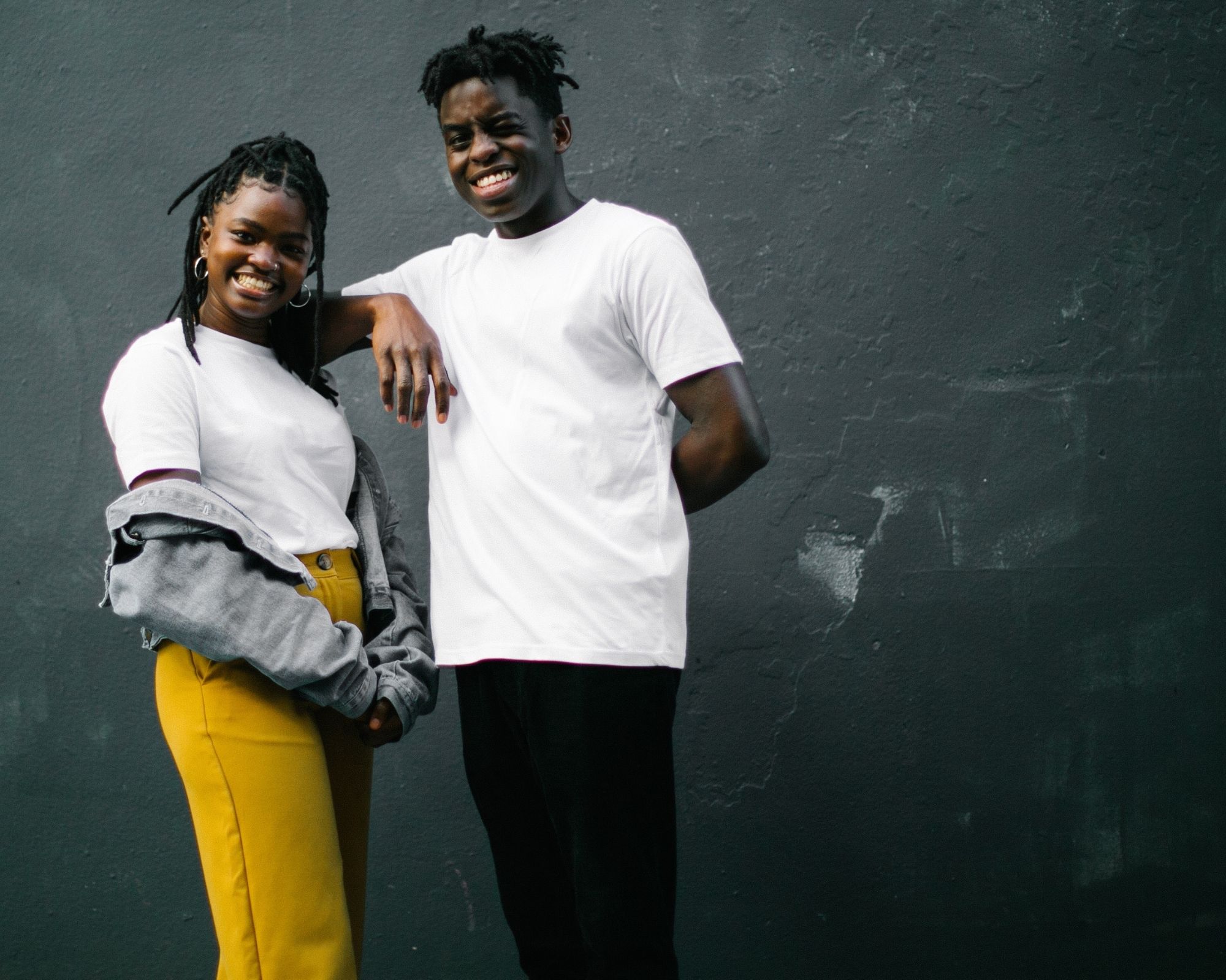 black woman and man wearing affordable white sustainable tee by Yes Friends