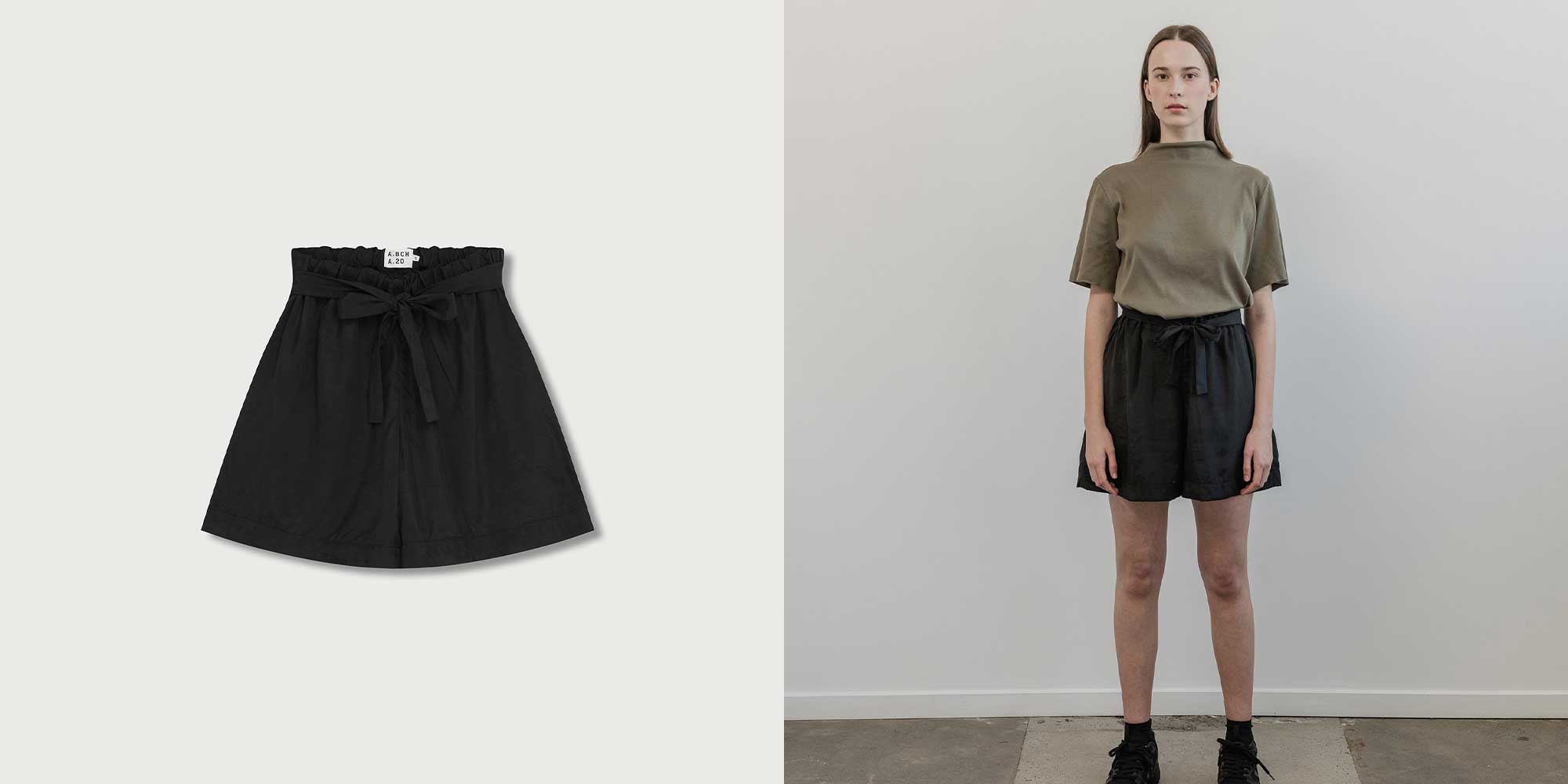 woman wearing black belted shorts by abch