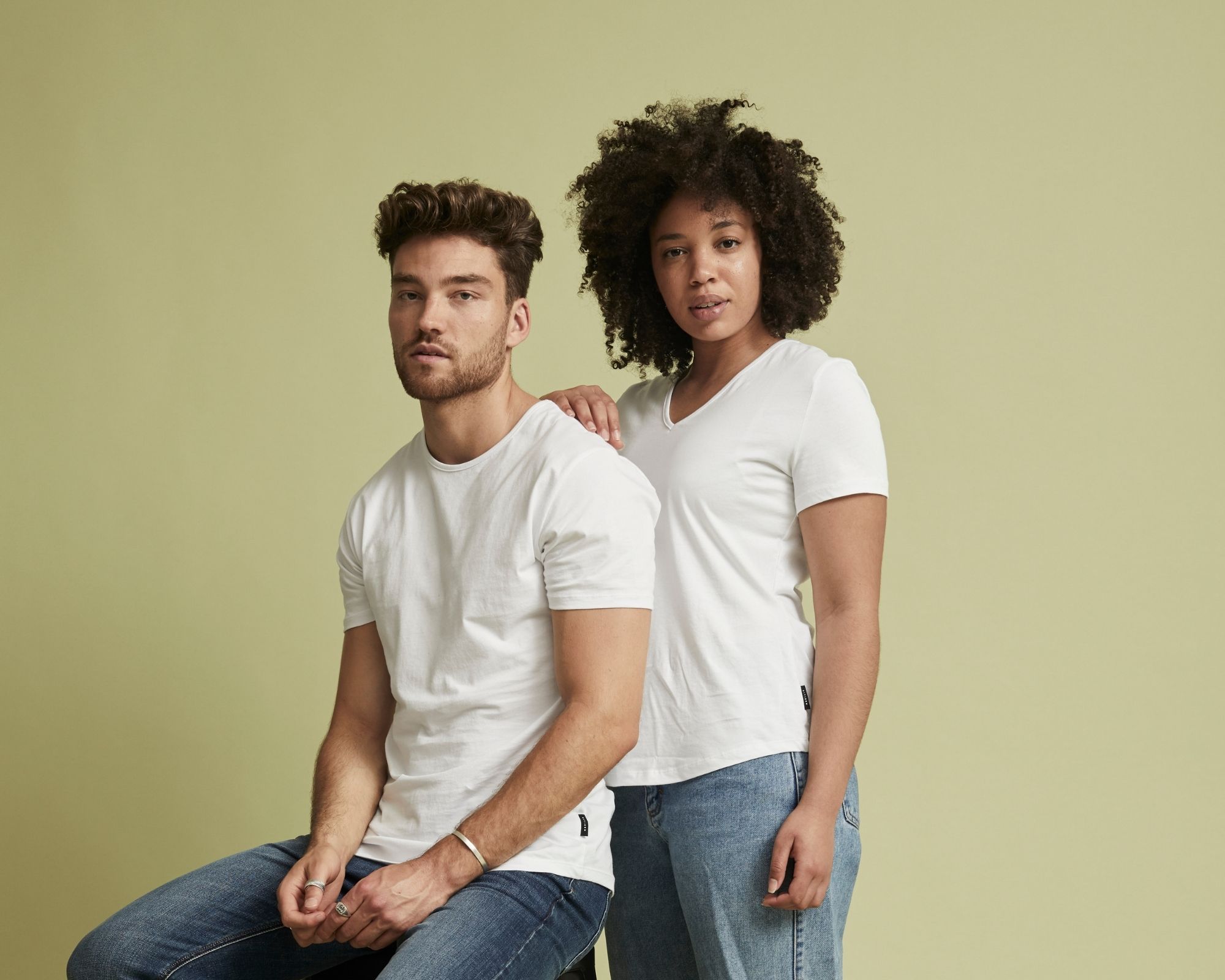 two people wearing white sustainable tshirts by Citizen Wolf