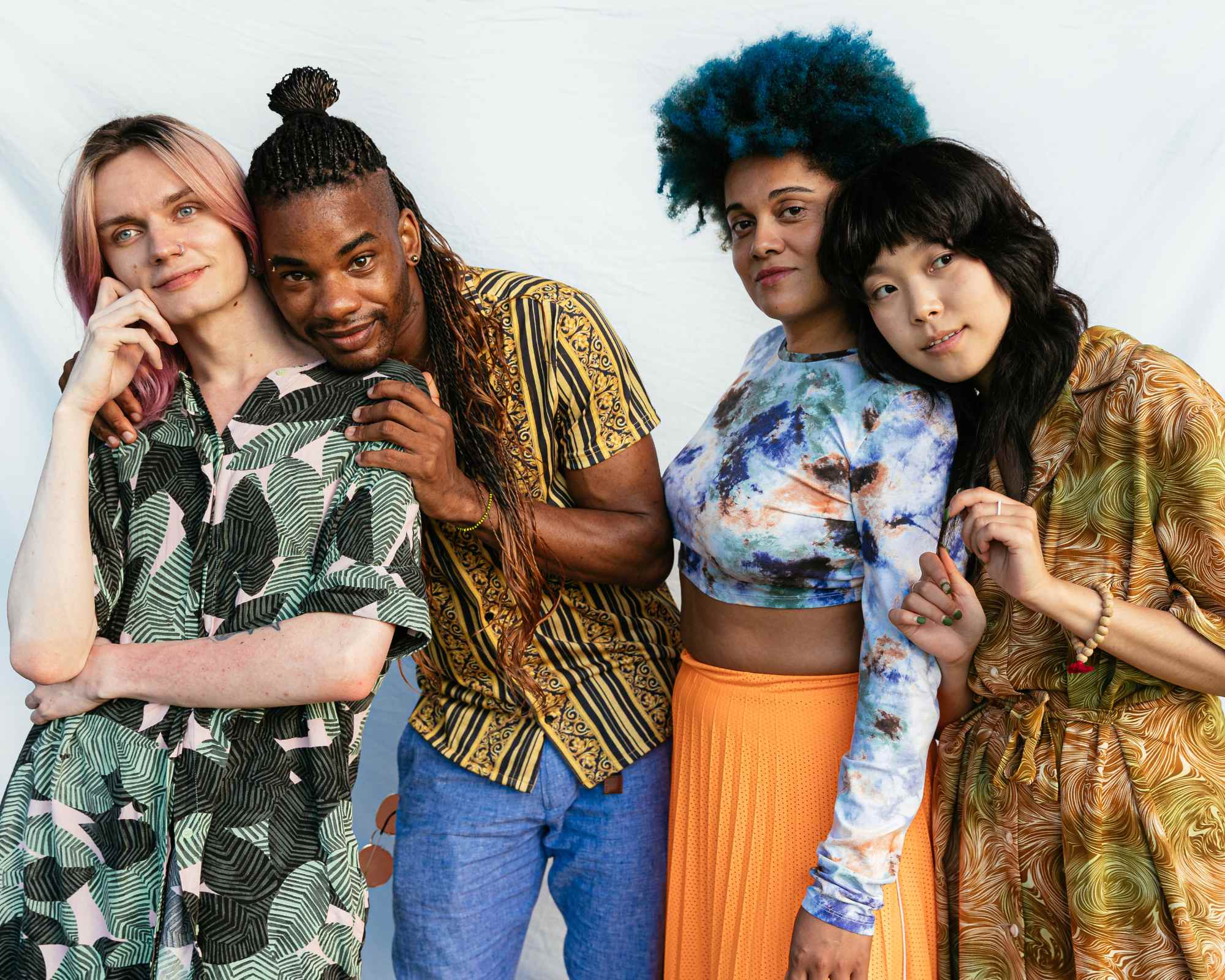 Three people in patterned clothing