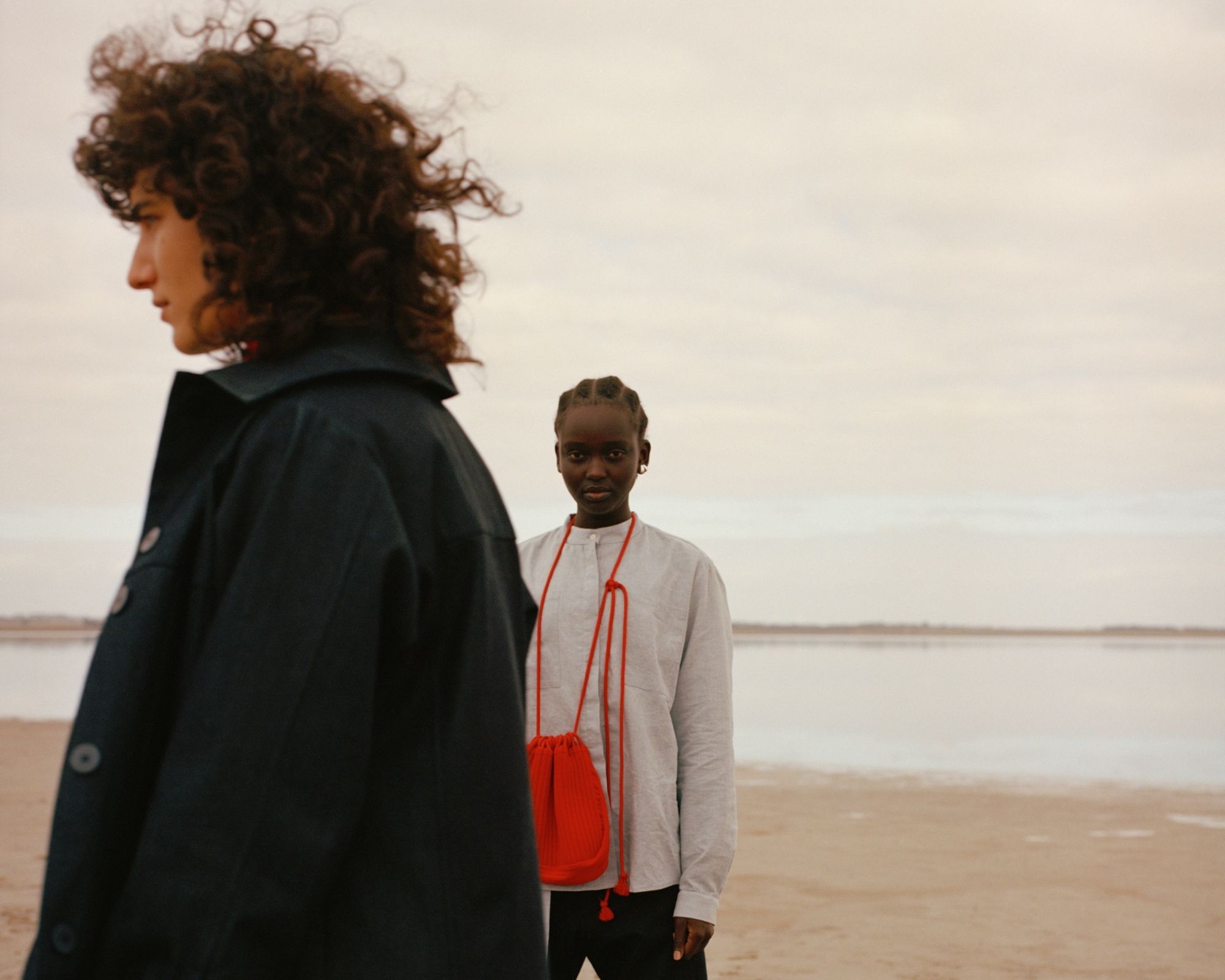 two people on a beach wearing ethical fashion by A.BCH