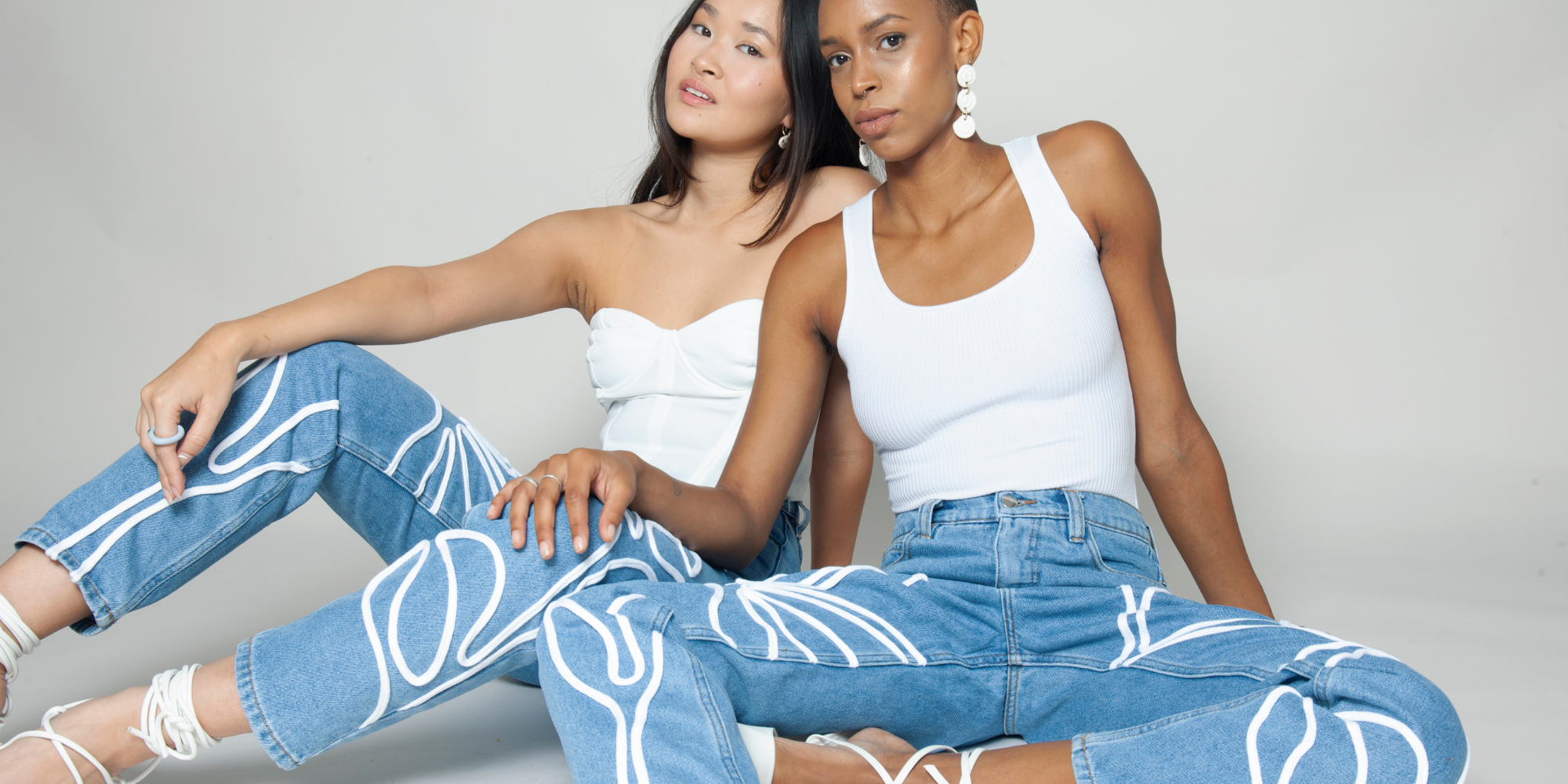 people in white tops and recycled jeans by Fanfare