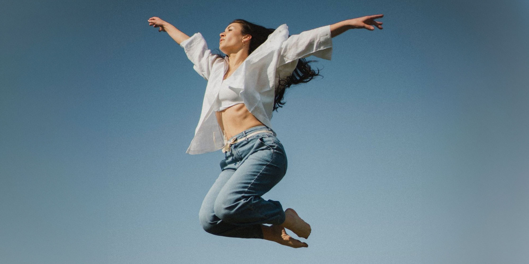 woman jumping in air