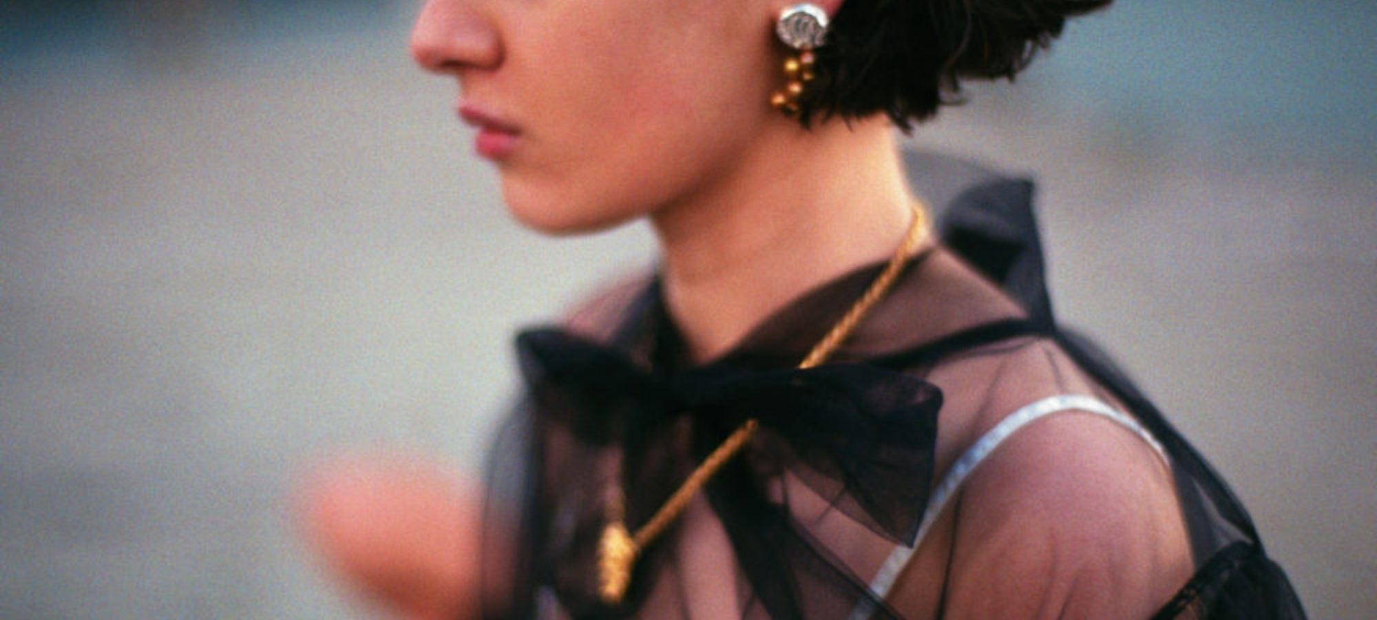 woman wearing gold ethically made jewellery by YU STEPANEL