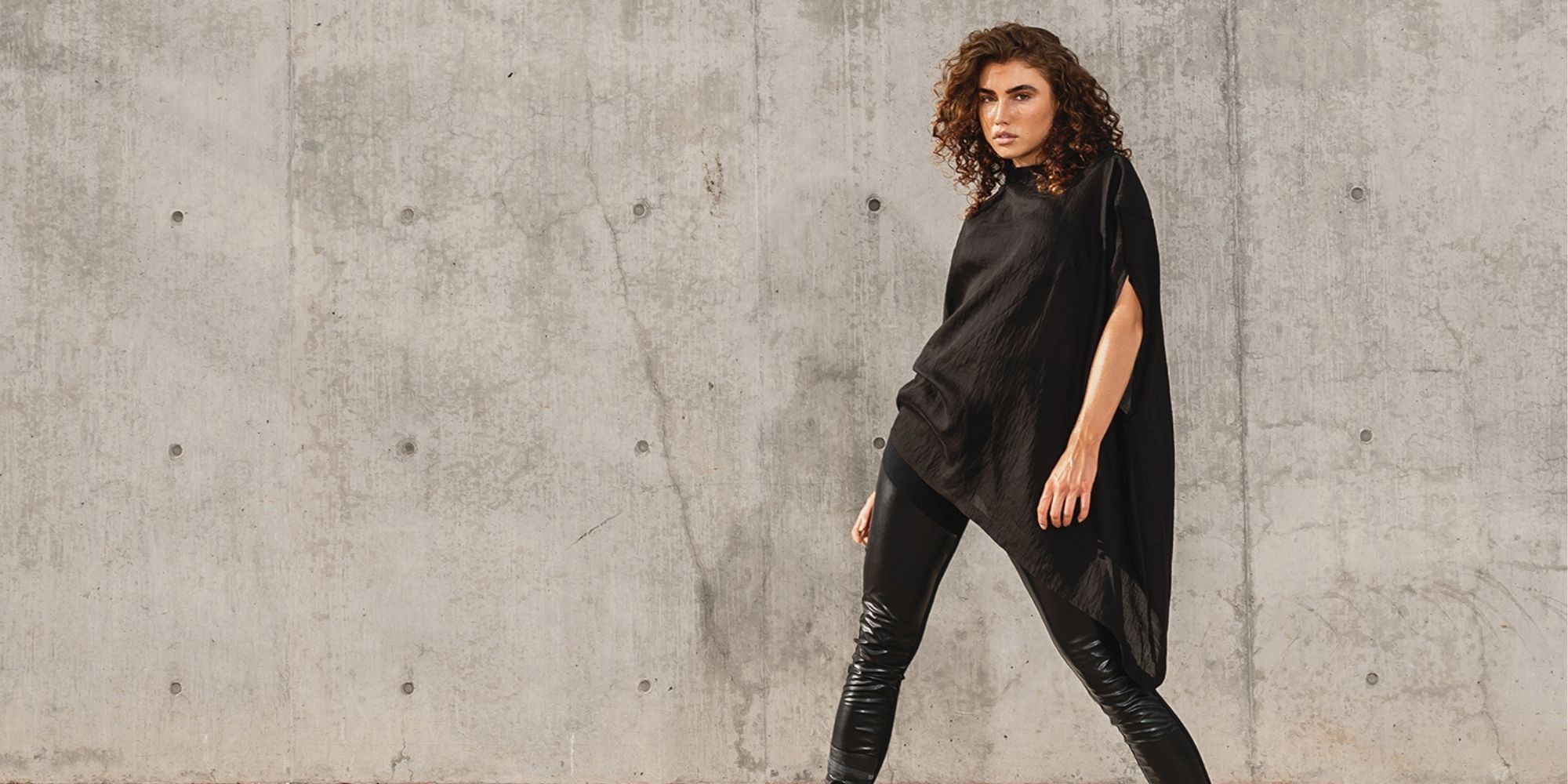 woman wearing black sustainable top made by Malaika New York