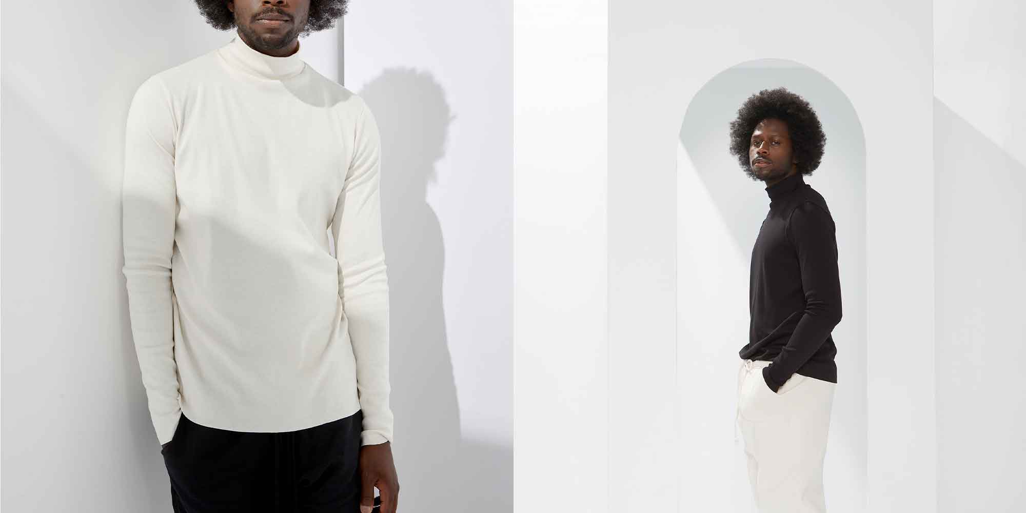 black man with afro wearing a white and a black mock neck skivvy made sustainably by A.BCH